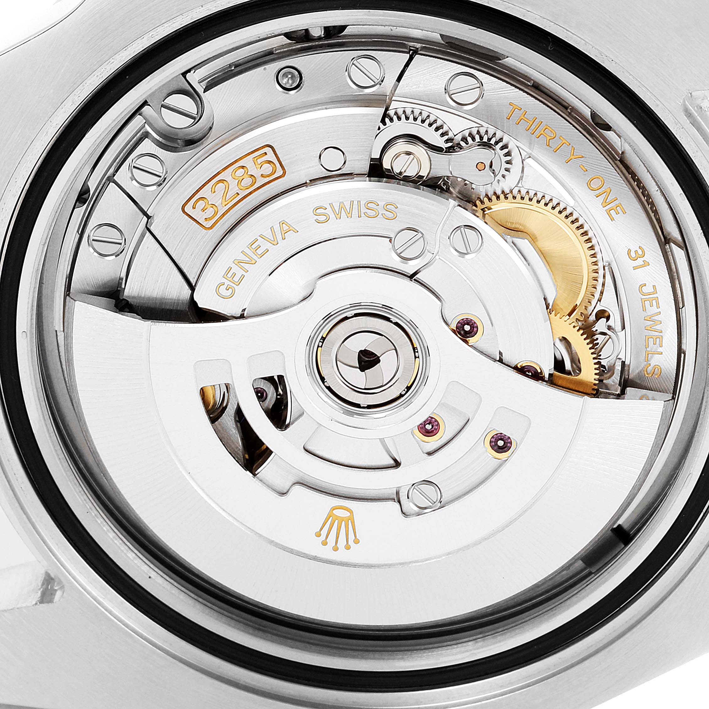 The image shows a close-up of the movement and internal mechanisms of the Rolex GMT-Master 126710 Men
s Stainless Steel Black Dial 126710 Men
s Stainless Steel Black Dial model.