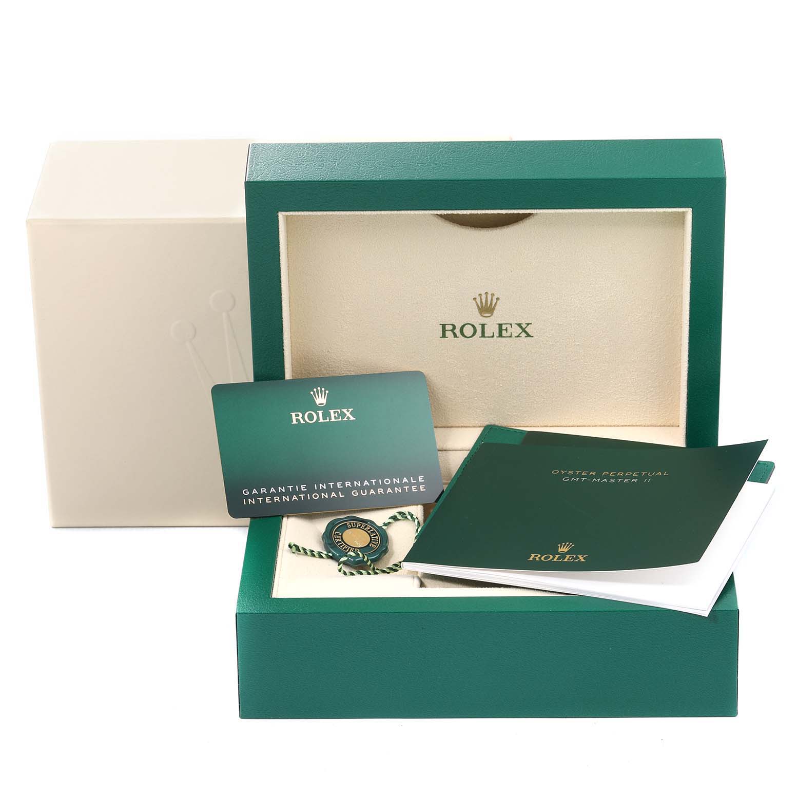 The image shows the packaging and accessories of a Rolex GMT-Master 126710 Men
s Stainless Steel Black Dial 126710 Men
s Stainless Steel Black Dial, including a warranty card, booklet, and green box.