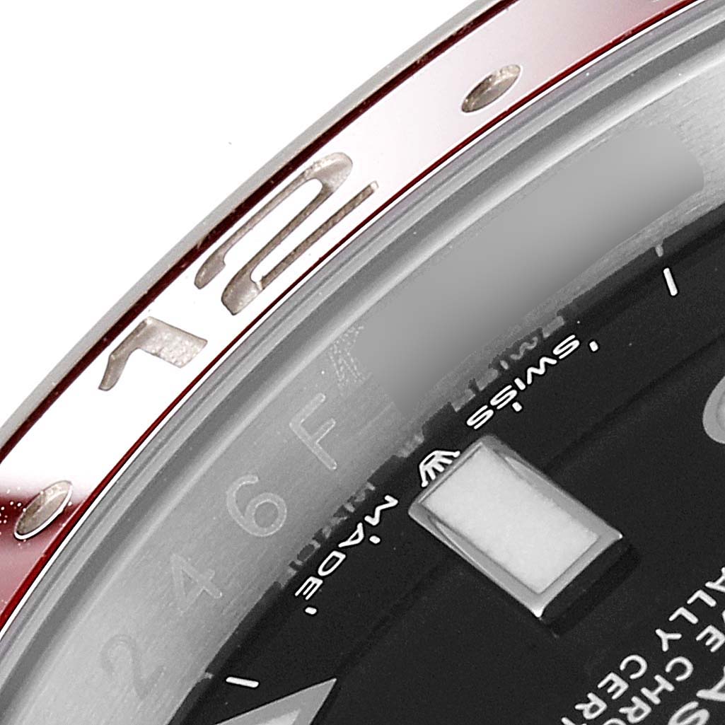 This close-up shows part of the bezel and dial of the Rolex GMT-Master 126710 Men's Stainless Steel Black Dial 126710 Men's Stainless Steel Black Dial watch.