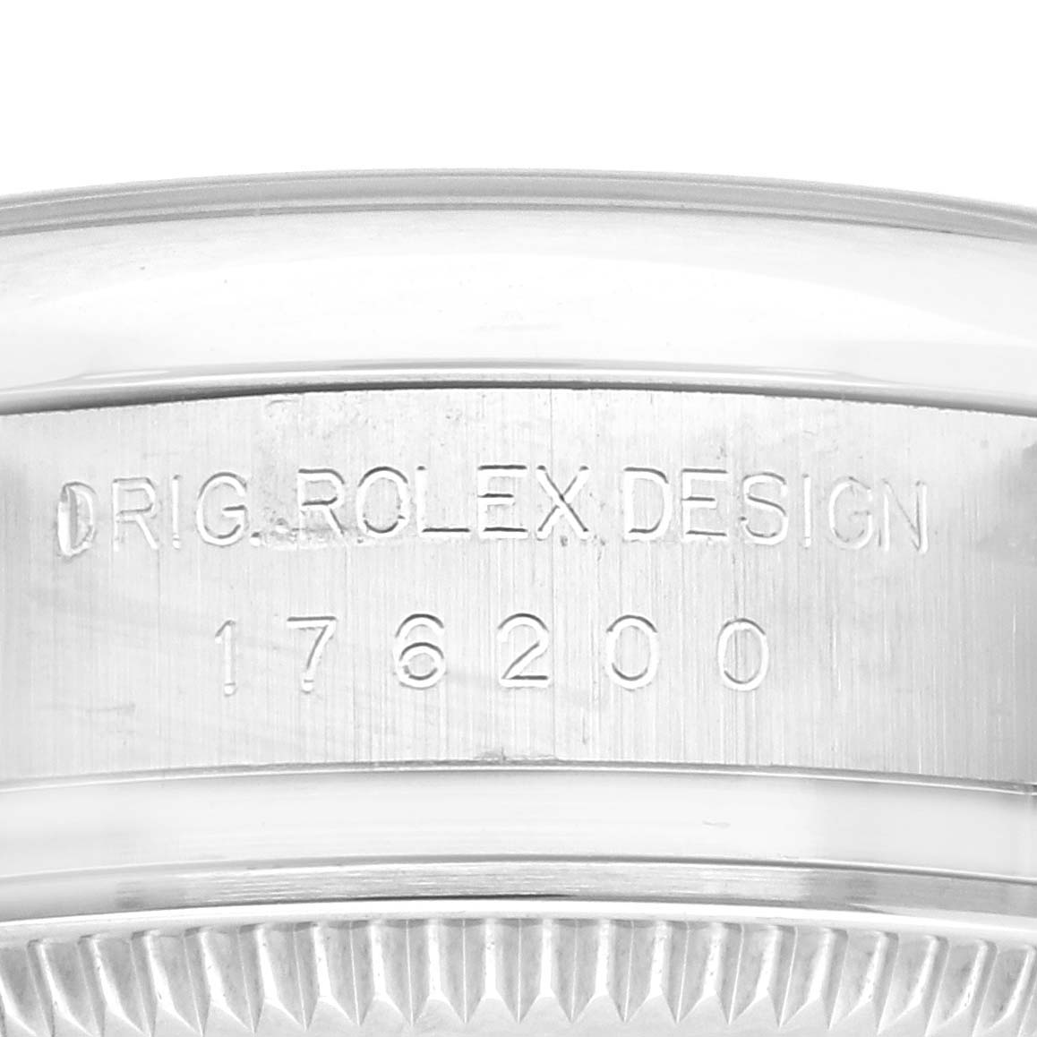 This image shows a close-up of the side of the case of a Rolex Oyster Perpetual 176200 Women's Stainless Steel Silver Dial 176200 Women's Stainless Steel Silver Dial watch, featuring its engraved model number.