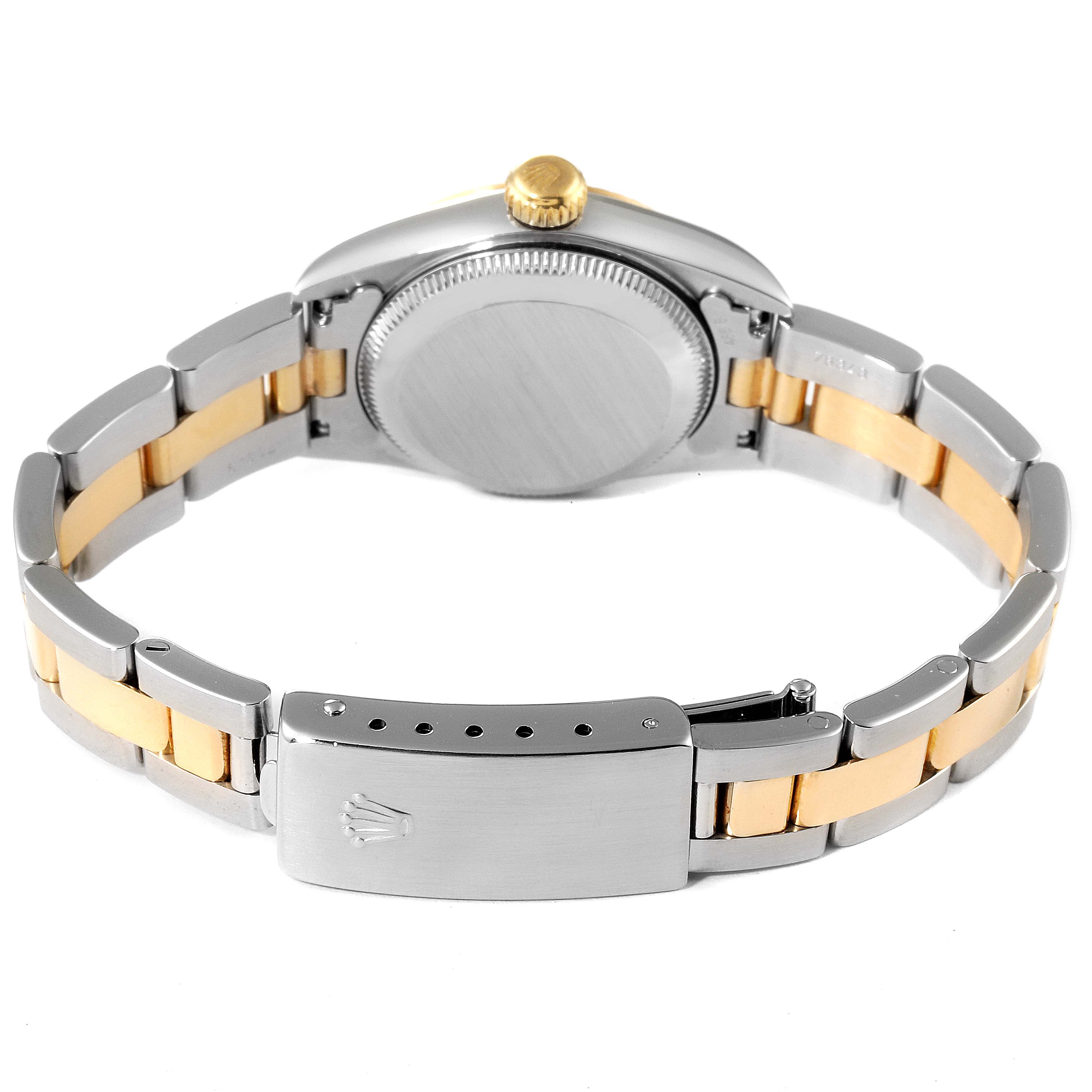 This image shows the back view of a Rolex Oyster Perpetual 67193 Women's Steel and Gold (two tone) Black Dial 67193 Women's Steel and Gold (two tone) Black Dial watch, highlighting the clasp, bracelet, and caseback.