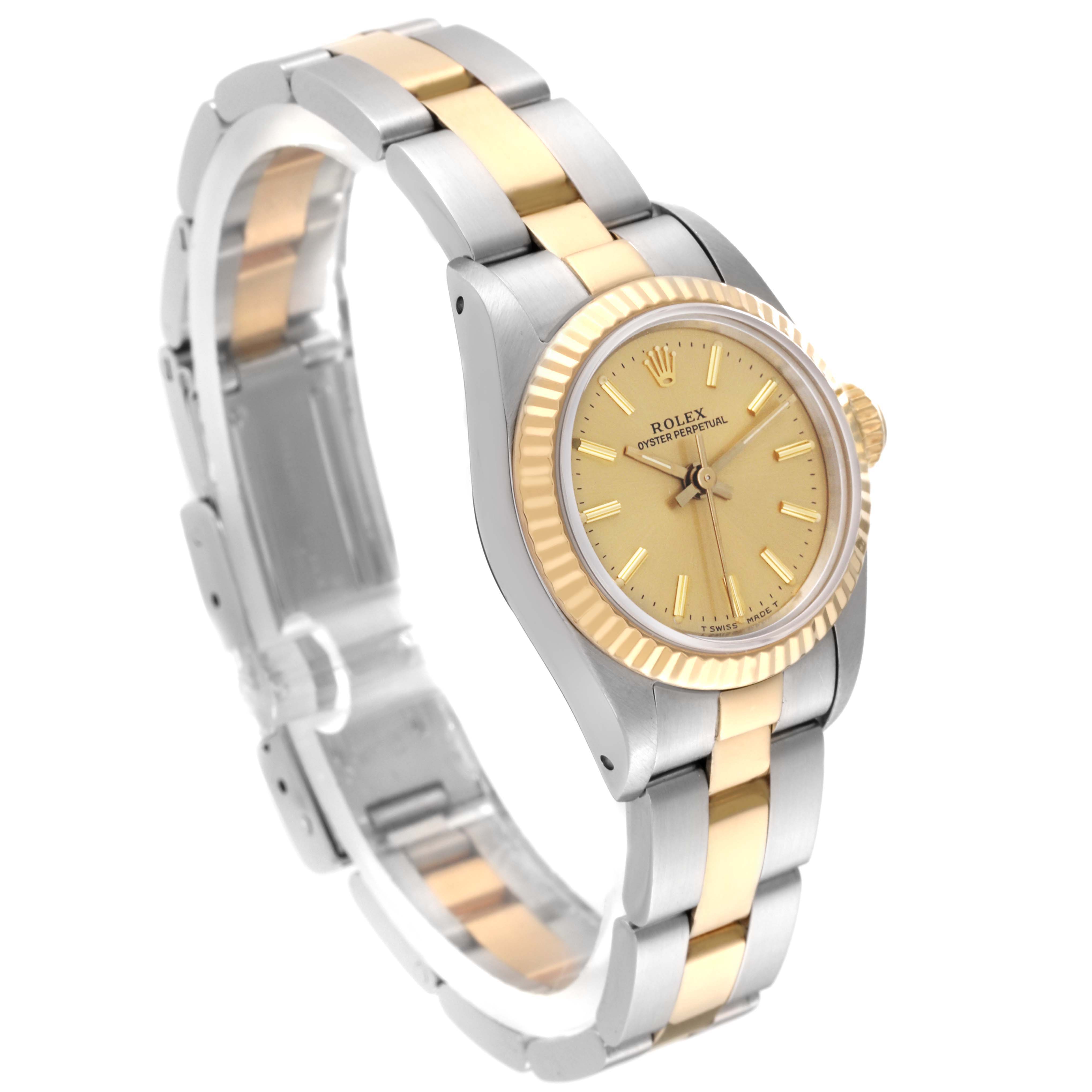 The image displays a Rolex Oyster Perpetual 67193 Women's Steel and Gold (two tone) Champagne Dial 67193 Women's Steel and Gold (two tone) Champagne Dial watch at an angled side view, showcasing its two-tone bracelet, case, and dial.