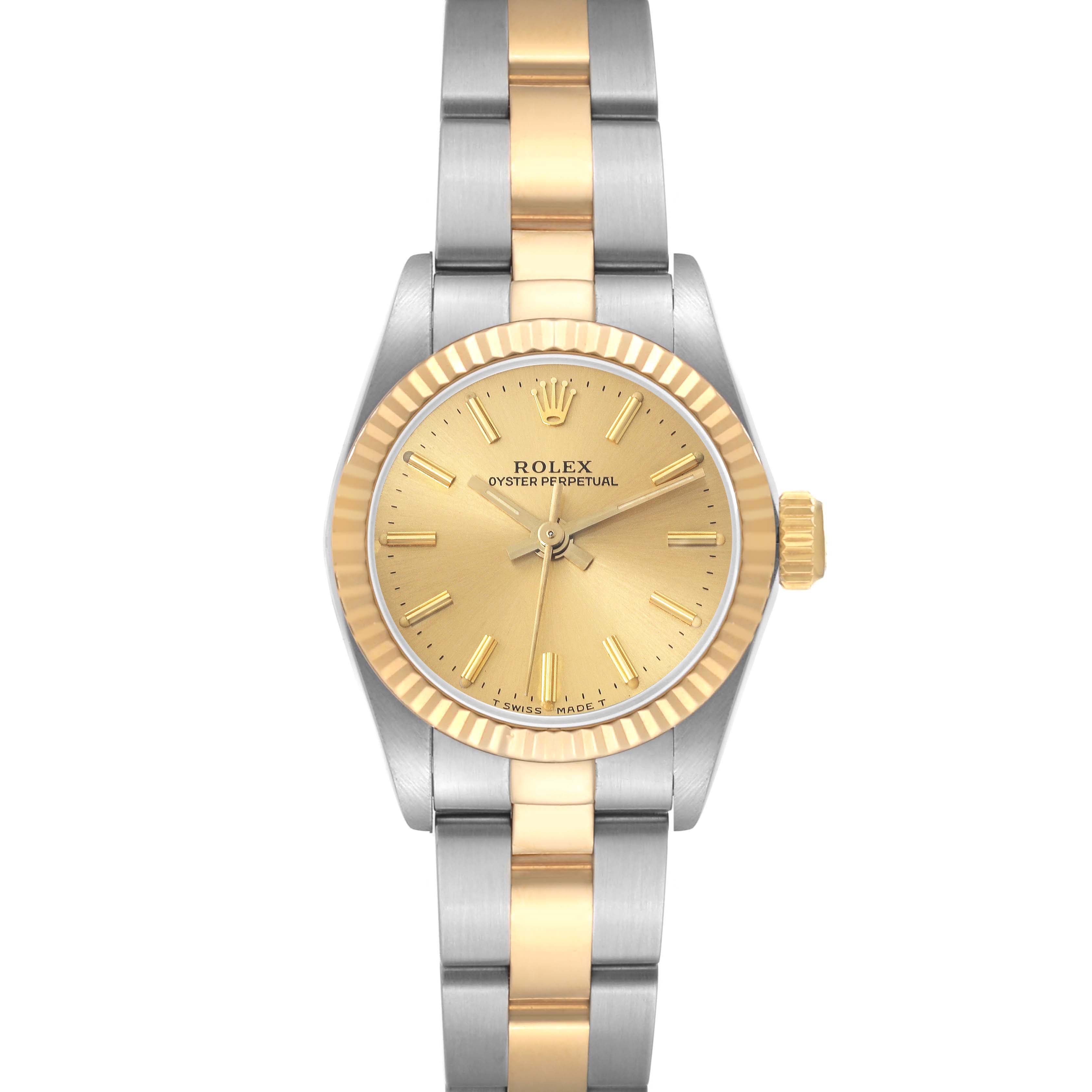 This image shows a front view of a Rolex Oyster Perpetual 67193 Women's Steel and Gold (two tone) Champagne Dial 67193 Women's Steel and Gold (two tone) Champagne Dial watch, highlighting its two-tone bracelet, gold dial, and fluted bezel.