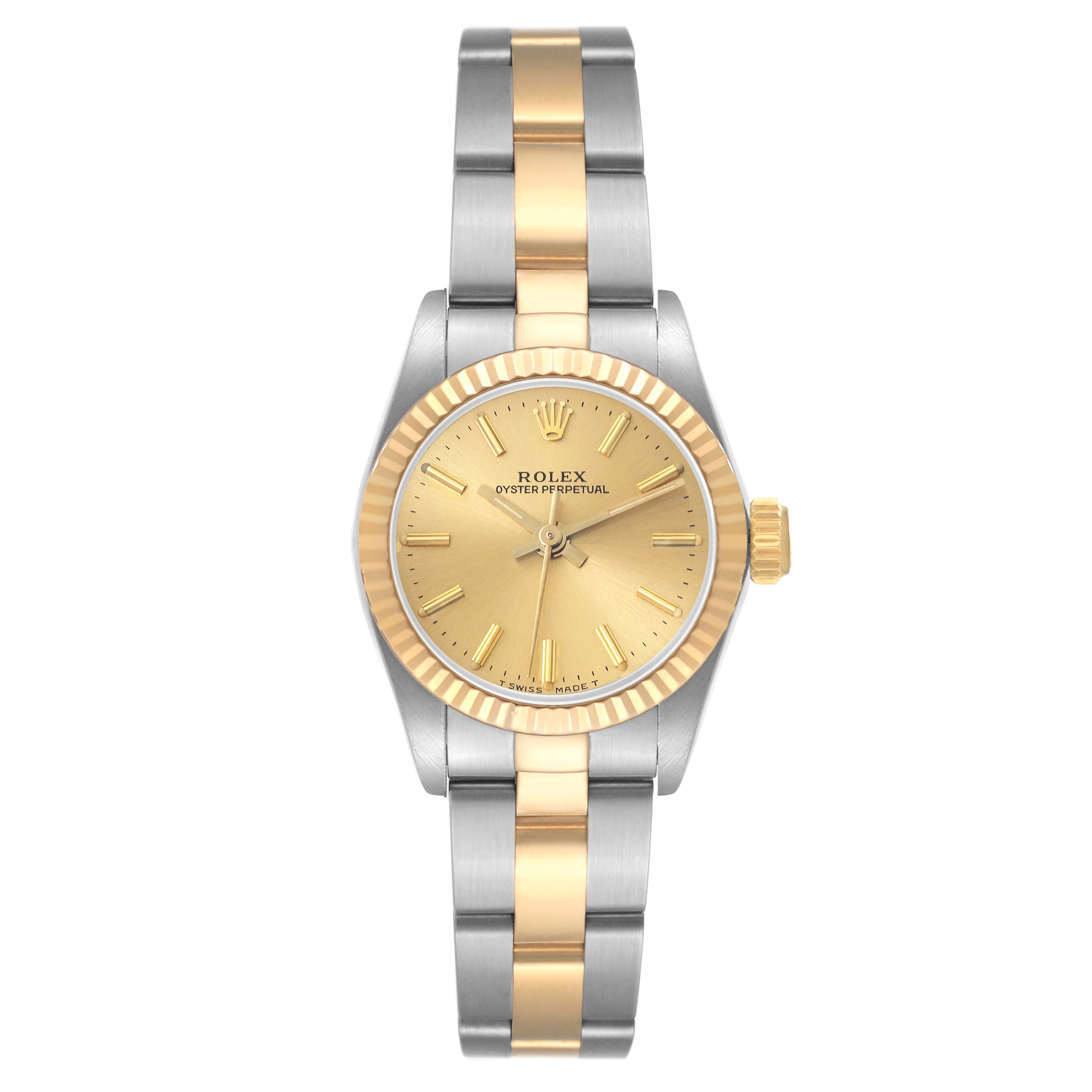 The image shows a front view of a Rolex Oyster Perpetual 67193 Women's Steel and Gold (two tone) Champagne Dial 67193 Women's Steel and Gold (two tone) Champagne Dial watch featuring a gold face, fluted bezel, and a two-tone metal bracelet.
