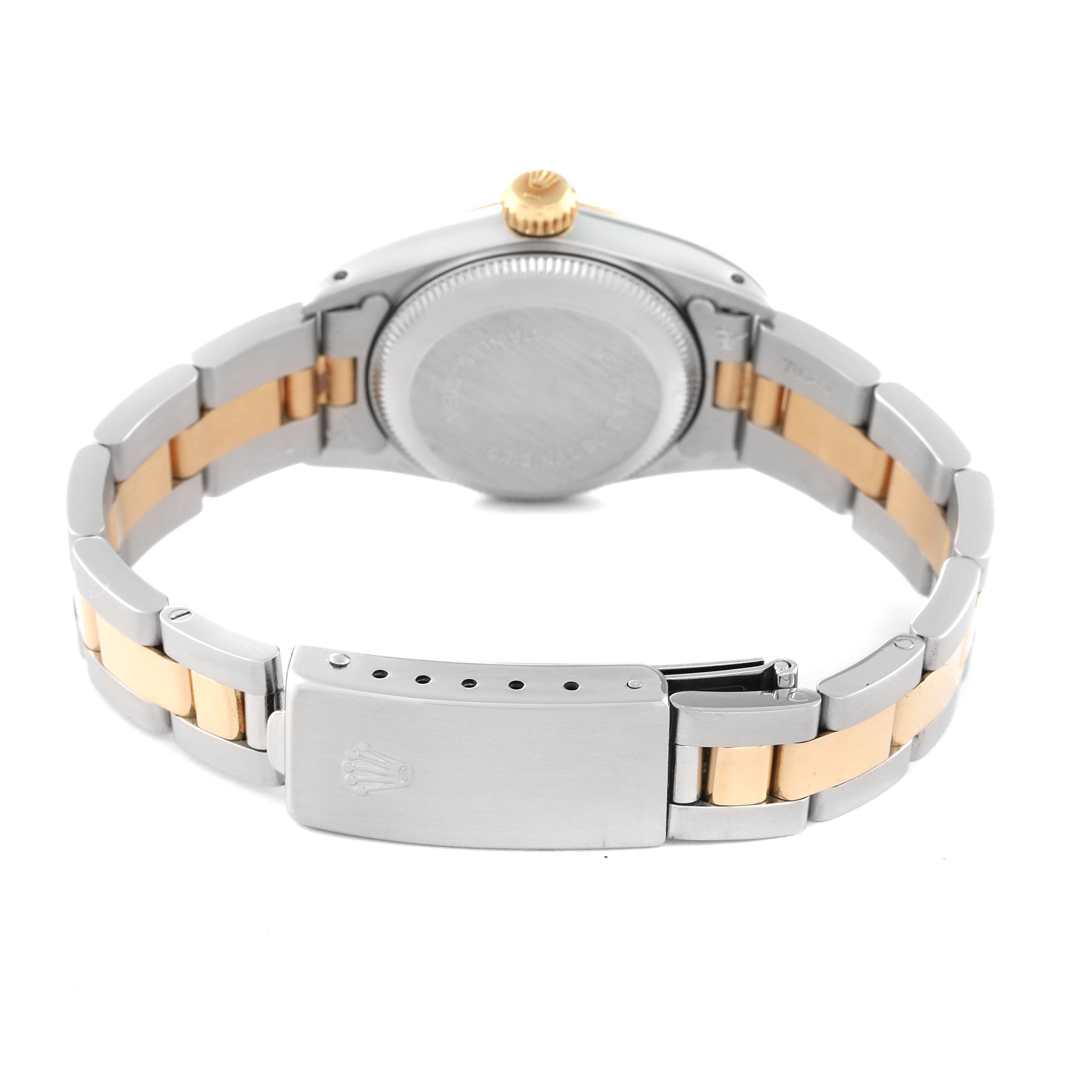 This image shows a Rolex Oyster Perpetual 67193 Women's Steel and Gold (two tone) Champagne Dial 67193 Women's Steel and Gold (two tone) Champagne Dial's backside, highlighting the bracelet, clasp, and caseback.