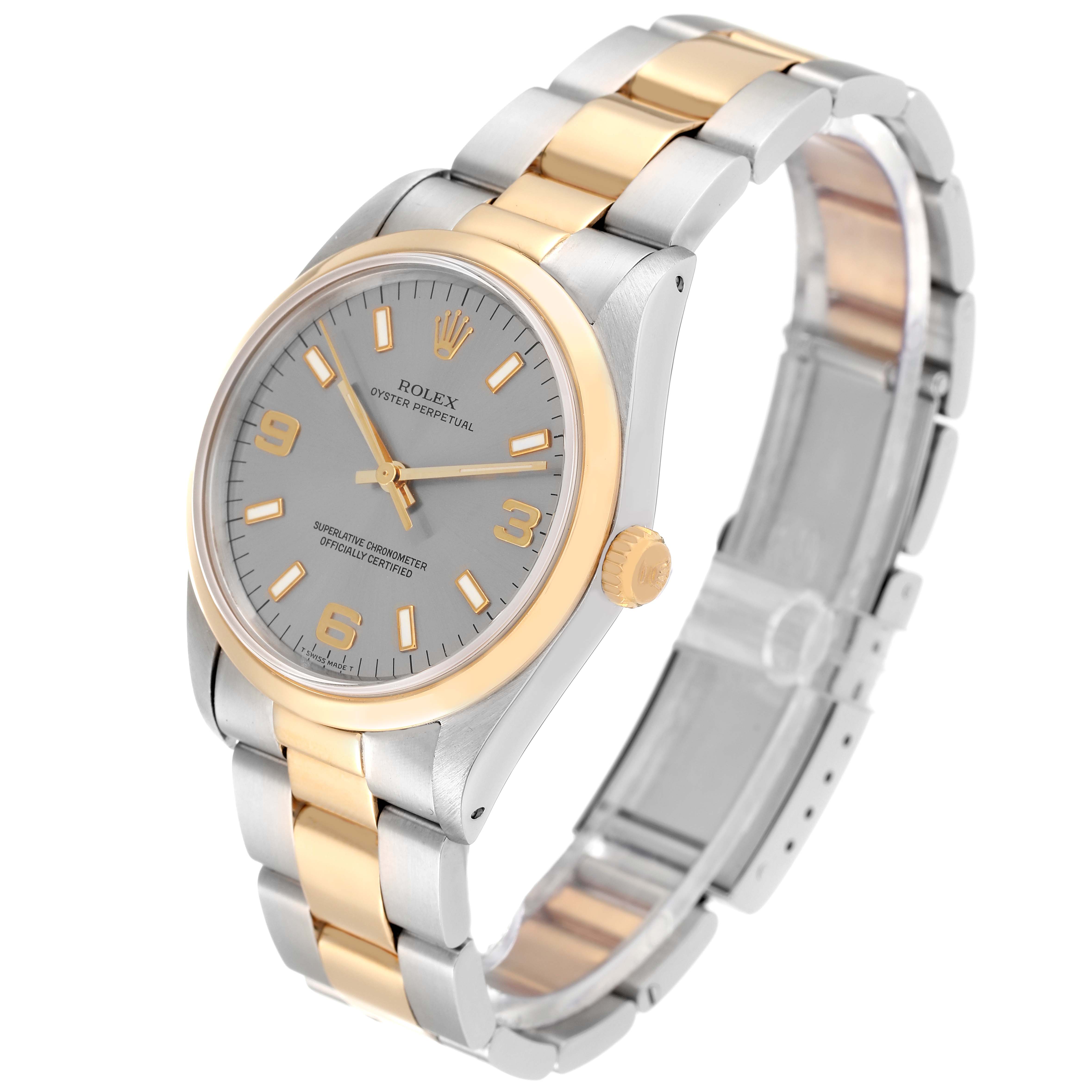 The Rolex Oyster Perpetual 14203 Men's Steel and Gold (two tone) Grey Dial 14203 Men's Steel and Gold (two tone) Grey Dial watch is shown at a three-quarter angle, displaying its face, bezel, crown, and bracelet.