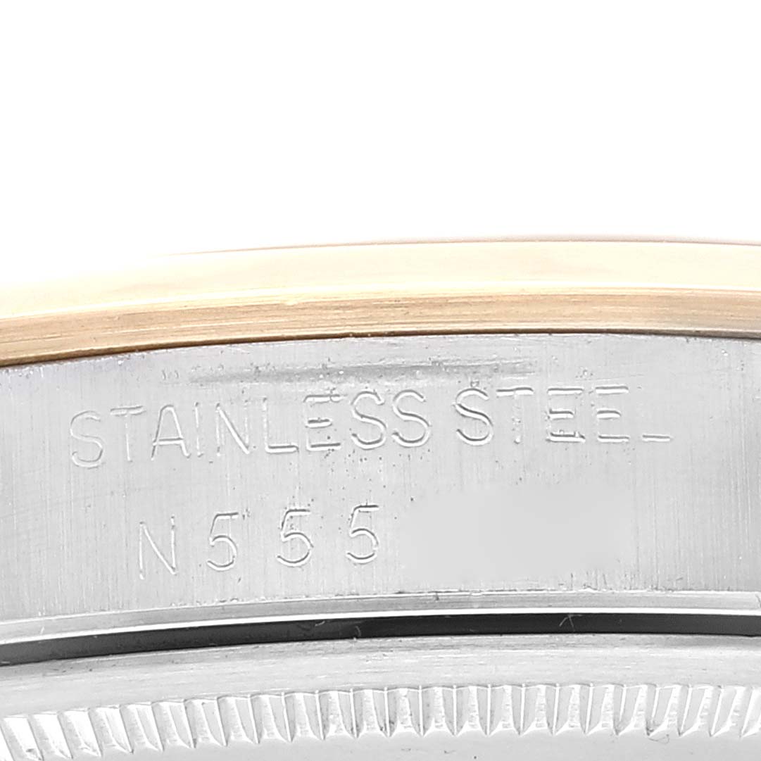 This image shows a close-up of the stainless steel caseback with engravings on a Rolex Oyster Perpetual 14203 Men's Steel and Gold (two tone) Grey Dial 14203 Men's Steel and Gold (two tone) Grey Dial watch.