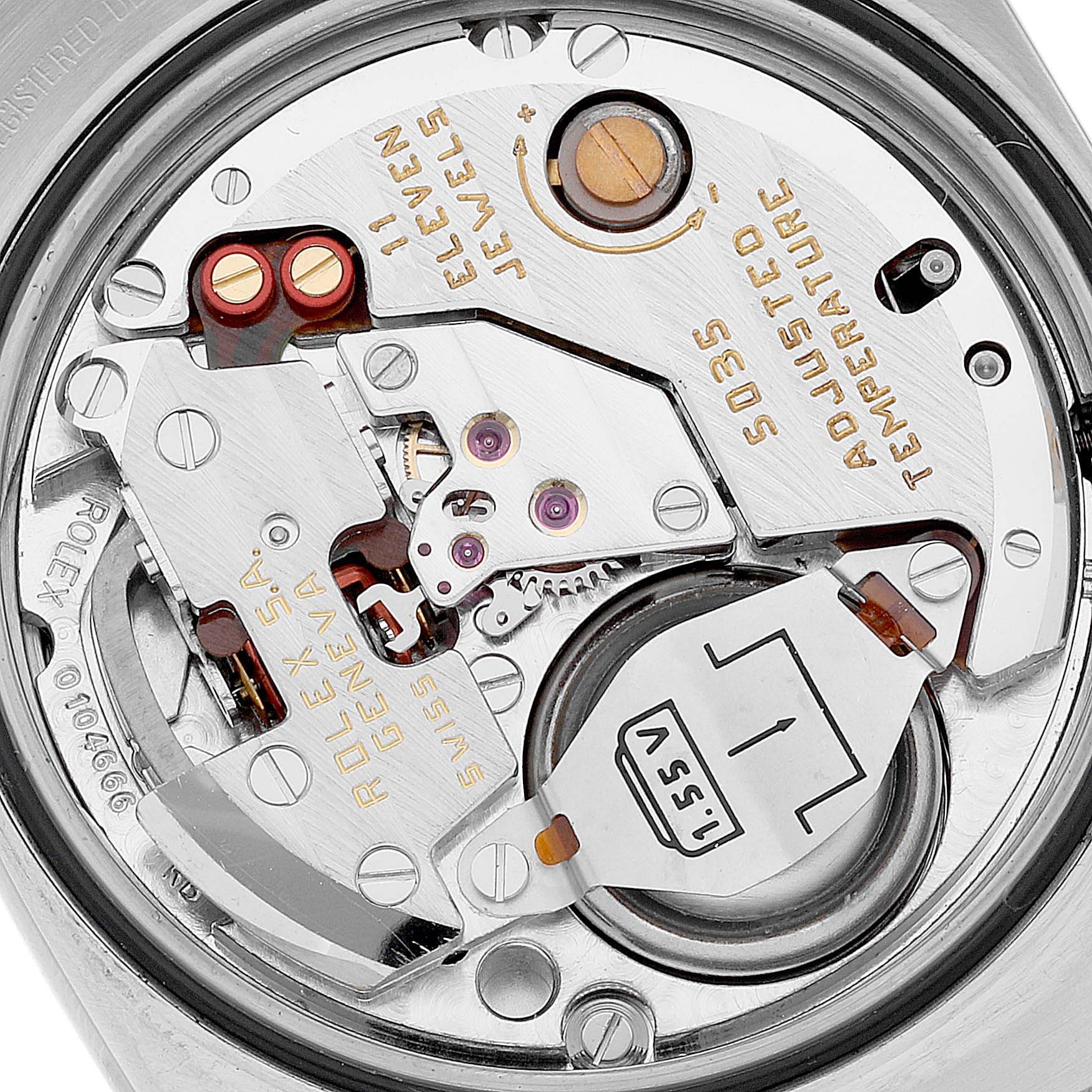 This image shows the movement and internal components of a Rolex Datejust 17013 Men's Steel and Gold (two tone) Black Dial 17013 Men's Steel and Gold (two tone) Black Dial watch, viewed from the back.