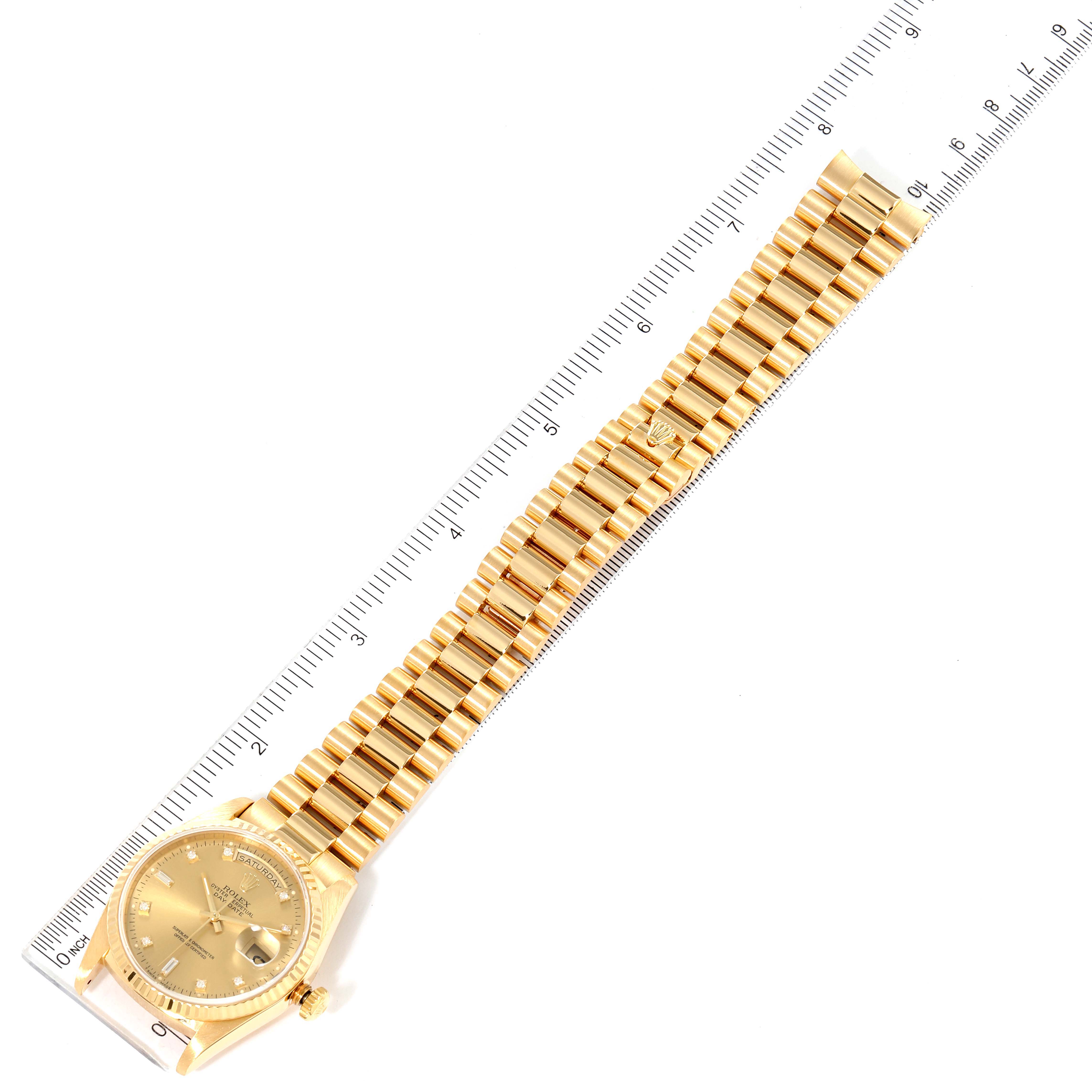 The Rolex President 18238 Men's Yellow Gold Champagne Dial 18238 Men's Yellow Gold Champagne Dial model watch is shown from a top-down angle, highlighting its gold band and face alongside a ruler for scale.