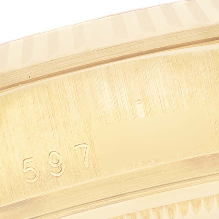 The image shows a close-up of the engraved serial number on the gold case of a Rolex President 18038 Men's Yellow Gold Champagne Dial 18038 Men's Yellow Gold Champagne Dial model watch.