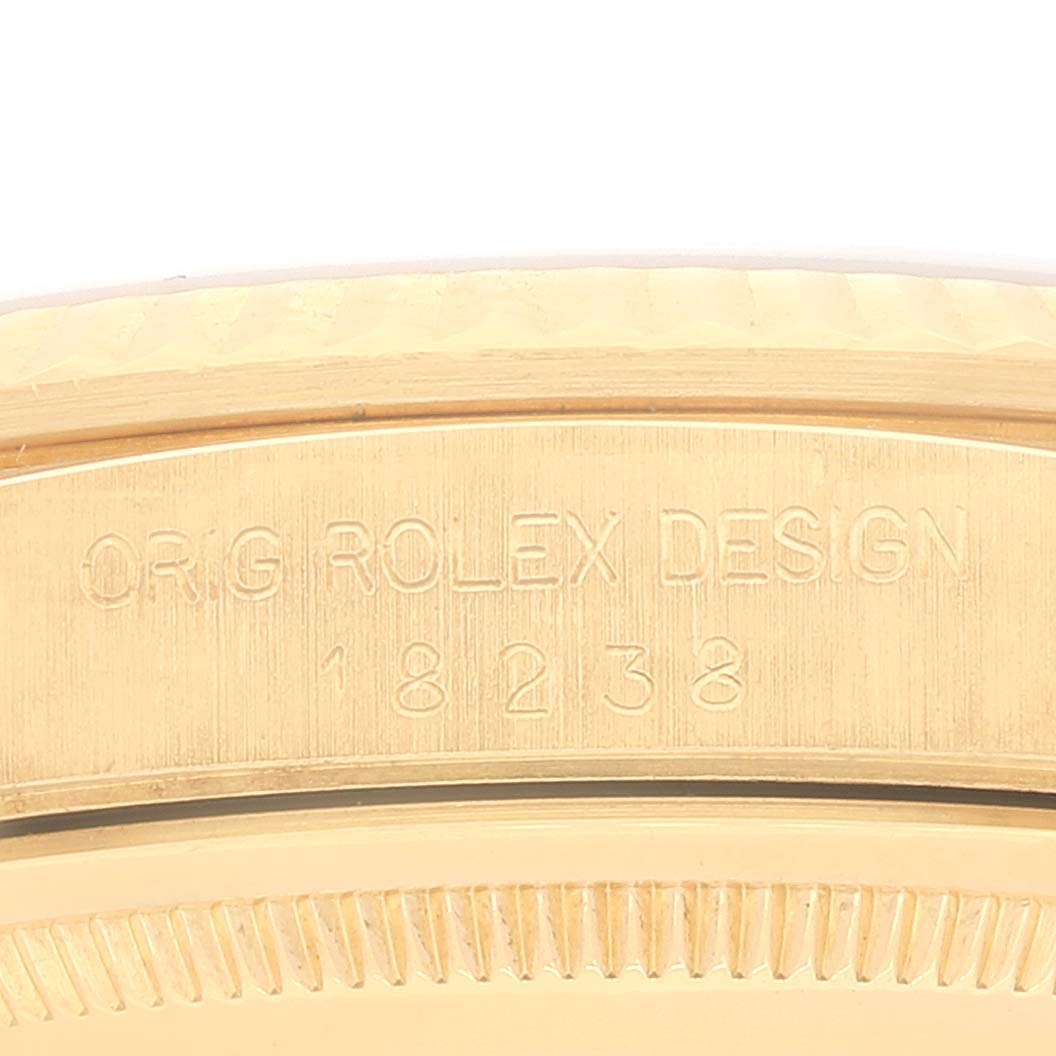 This image shows a close-up of the engraved case back of a Rolex President 18238 Men
s Yellow Gold Champagne Dial 18238 Men
s Yellow Gold Champagne Dial model watch, displaying the serial number.