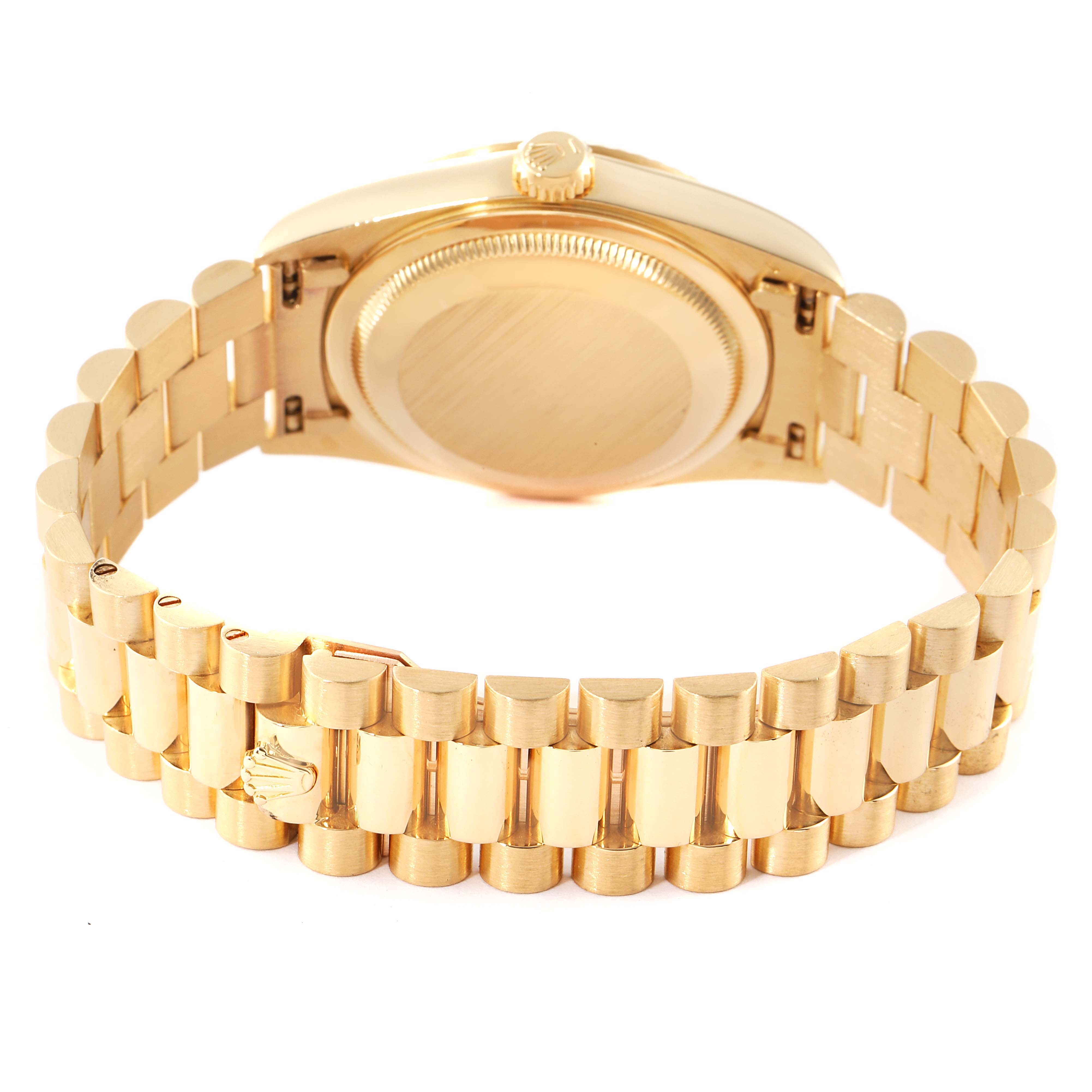 The image shows the gold case back and bracelet of a Rolex President 18238 Men
s Yellow Gold Champagne Dial 18238 Men
s Yellow Gold Champagne Dial model watch viewed from the rear.