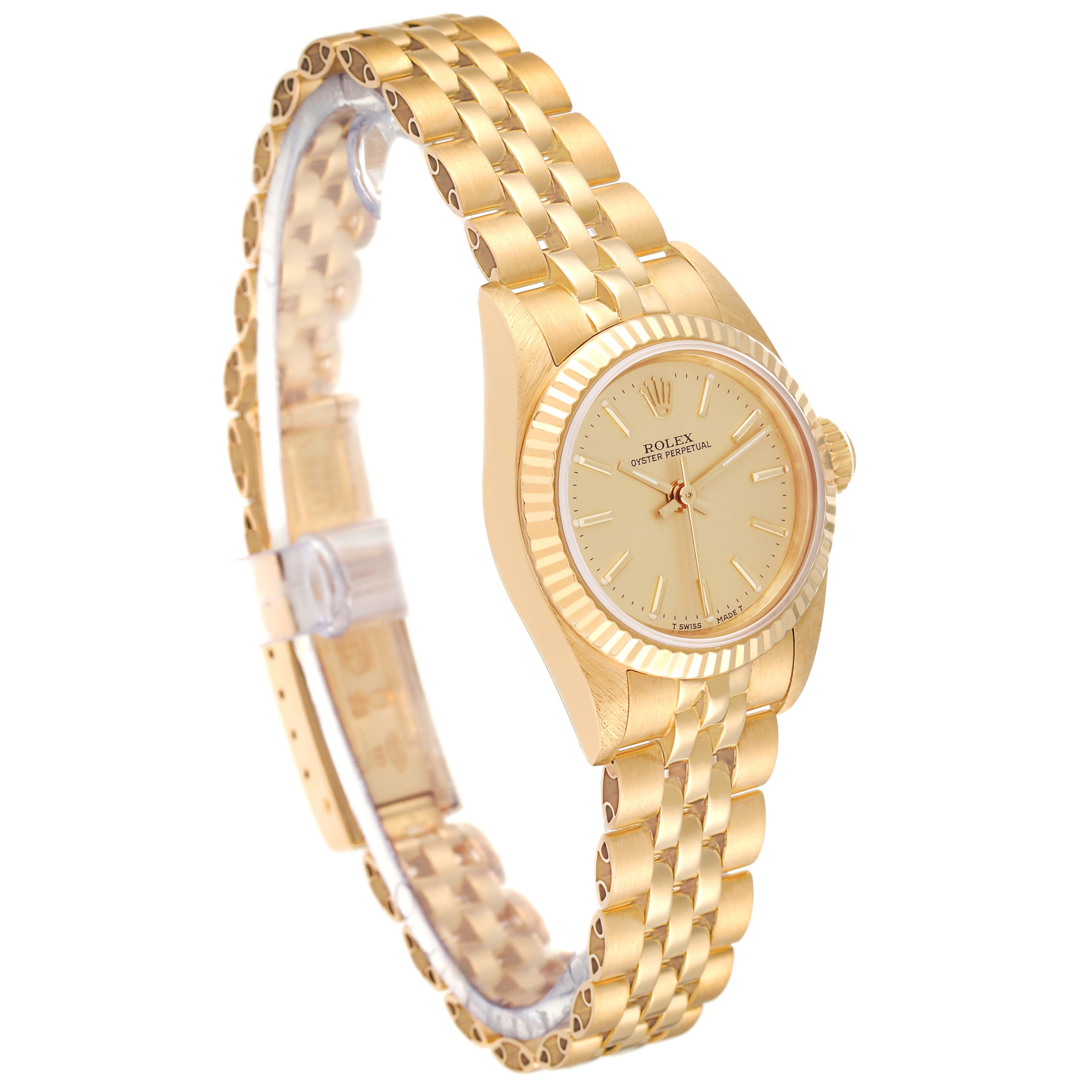 The image shows a gold Rolex President 67198 Women
s Yellow Gold Champagne Dial 67198 Women
s Yellow Gold Champagne Dial model watch with a side angle view, featuring its bracelet, case, and dial.