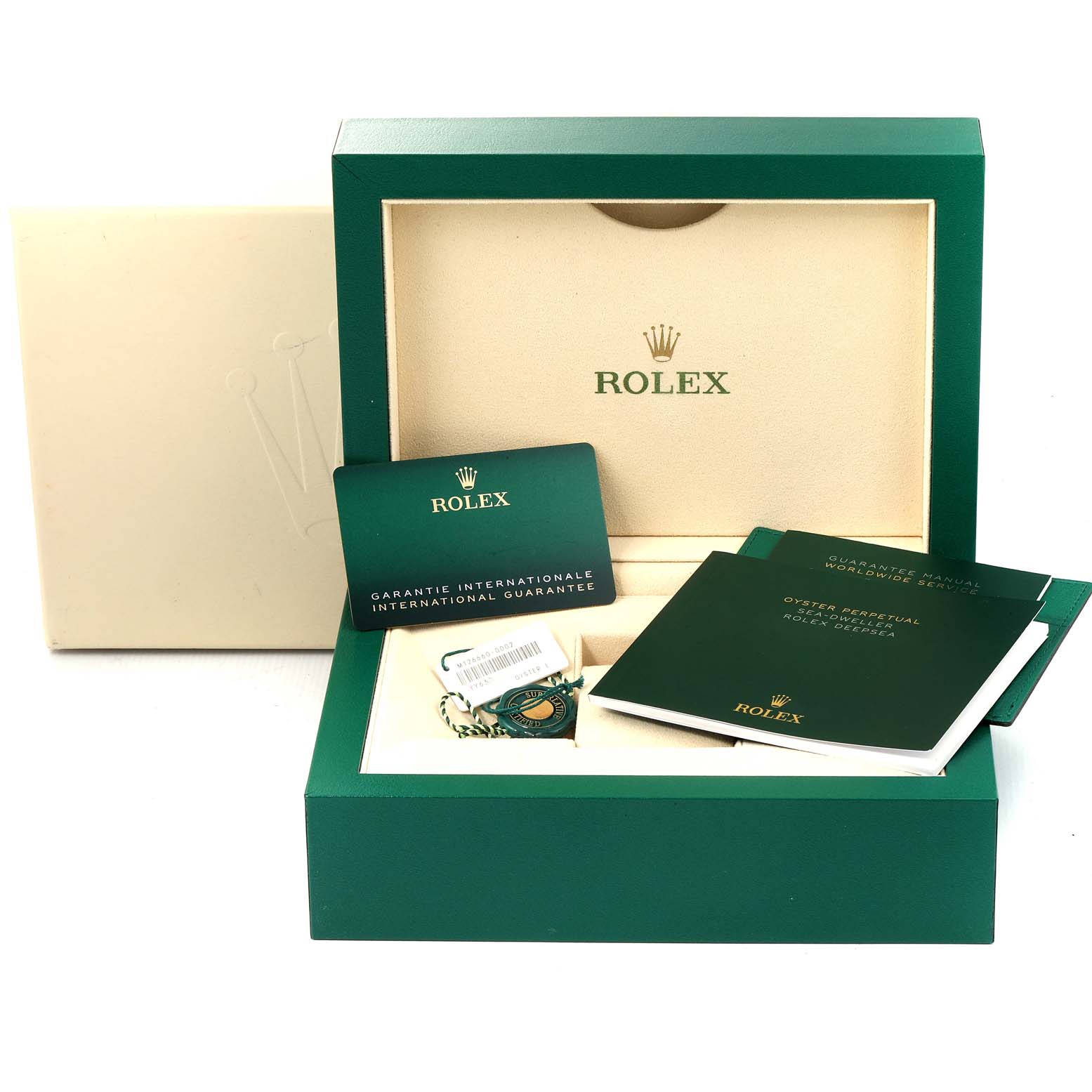 The image shows the packaging and accessories for a Rolex Sea-Dweller 126660 Men's Stainless Steel Blue Dial 126660 Men's Stainless Steel Blue Dial, including manuals, an international guarantee card, and tags.