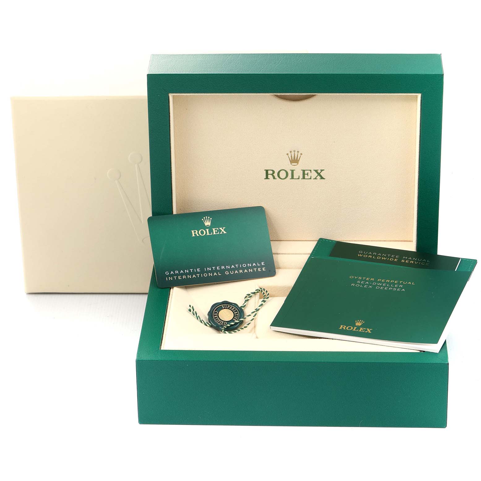This image shows the packaging and accessories of a Rolex Sea-Dweller 126660 Men
s Stainless Steel Blue Dial 126660 Men
s Stainless Steel Blue Dial watch, including manuals, guarantee card, and a box.