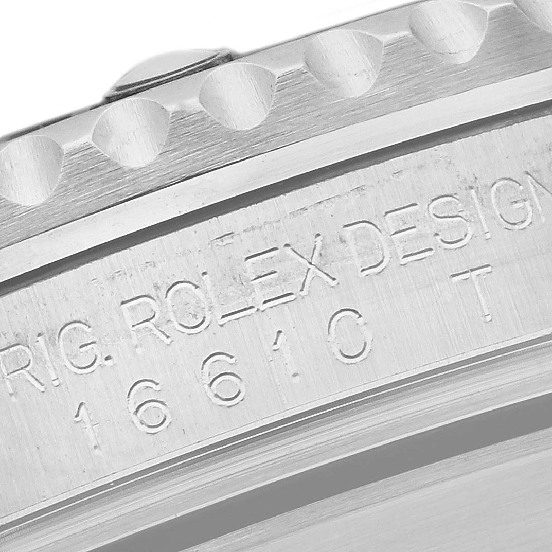 The image shows a close-up of the side engraving and bezel details on a Rolex Submariner 16610 Men
s Stainless Steel Black Dial 16610 Men
s Stainless Steel Black Dial watch.