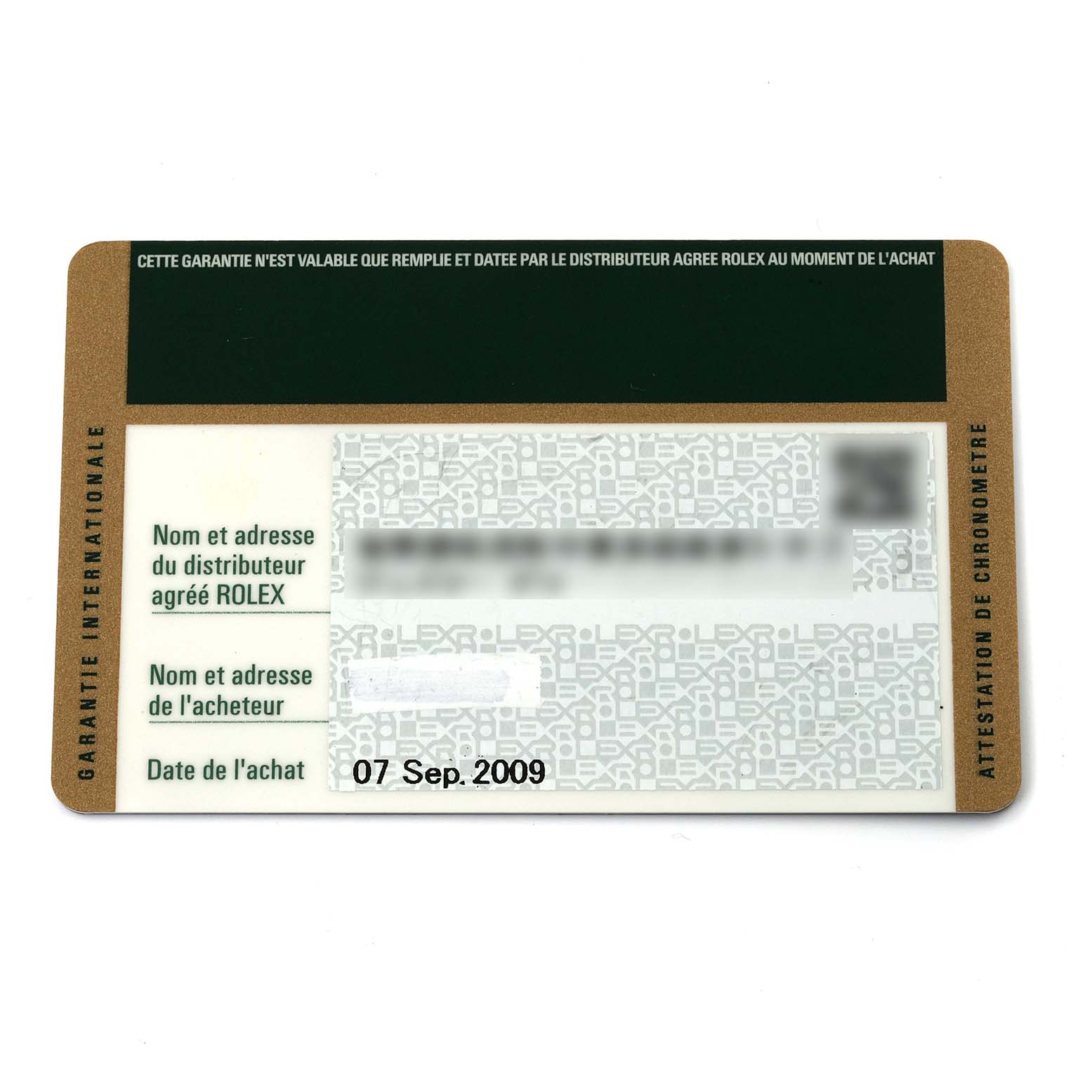 This image shows the warranty card for a Rolex Submariner 16610 Men
s Stainless Steel Black Dial 16610 Men
s Stainless Steel Black Dial watch, taken from a top-down angle.