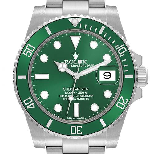 This close-up image shows the face of a Rolex Submariner watch with a green bezel and dial, including the date display.