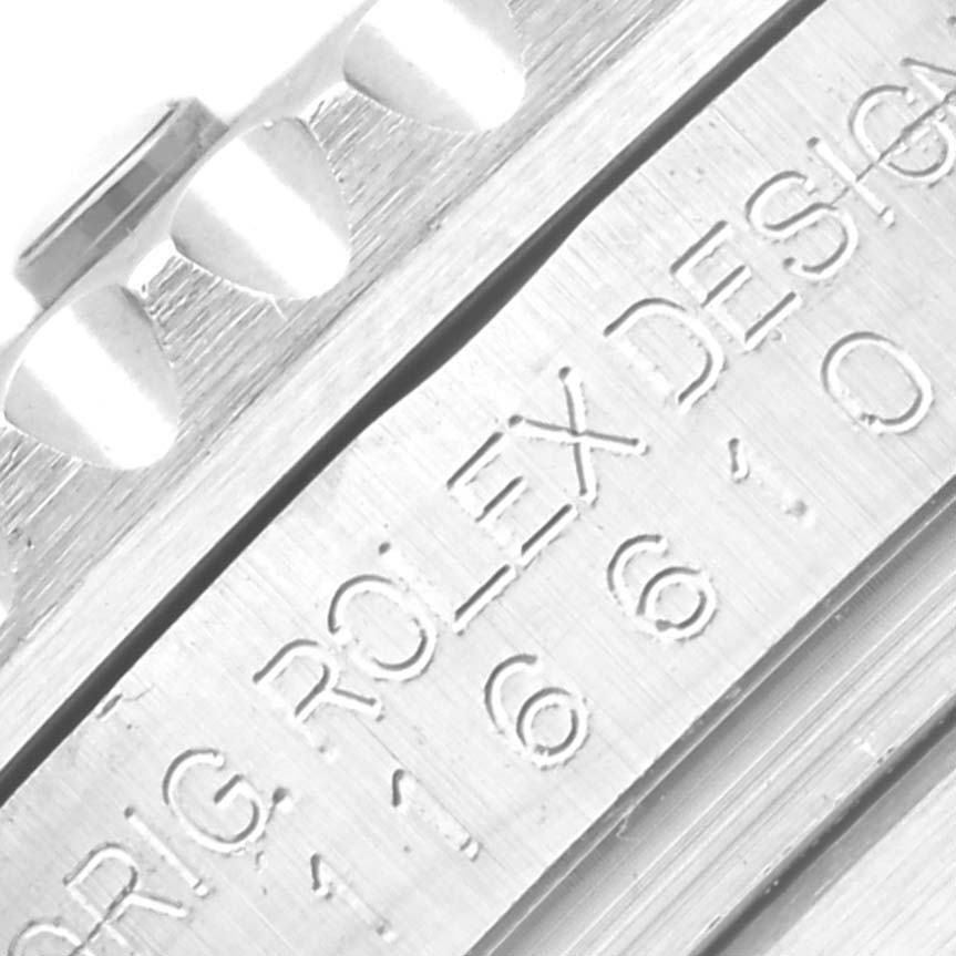 This image shows a close-up of the case and bezel engraving on a Rolex Submariner 116610LV Men's Stainless Steel Green Dial 116610LV Men's Stainless Steel Green Dial watch.