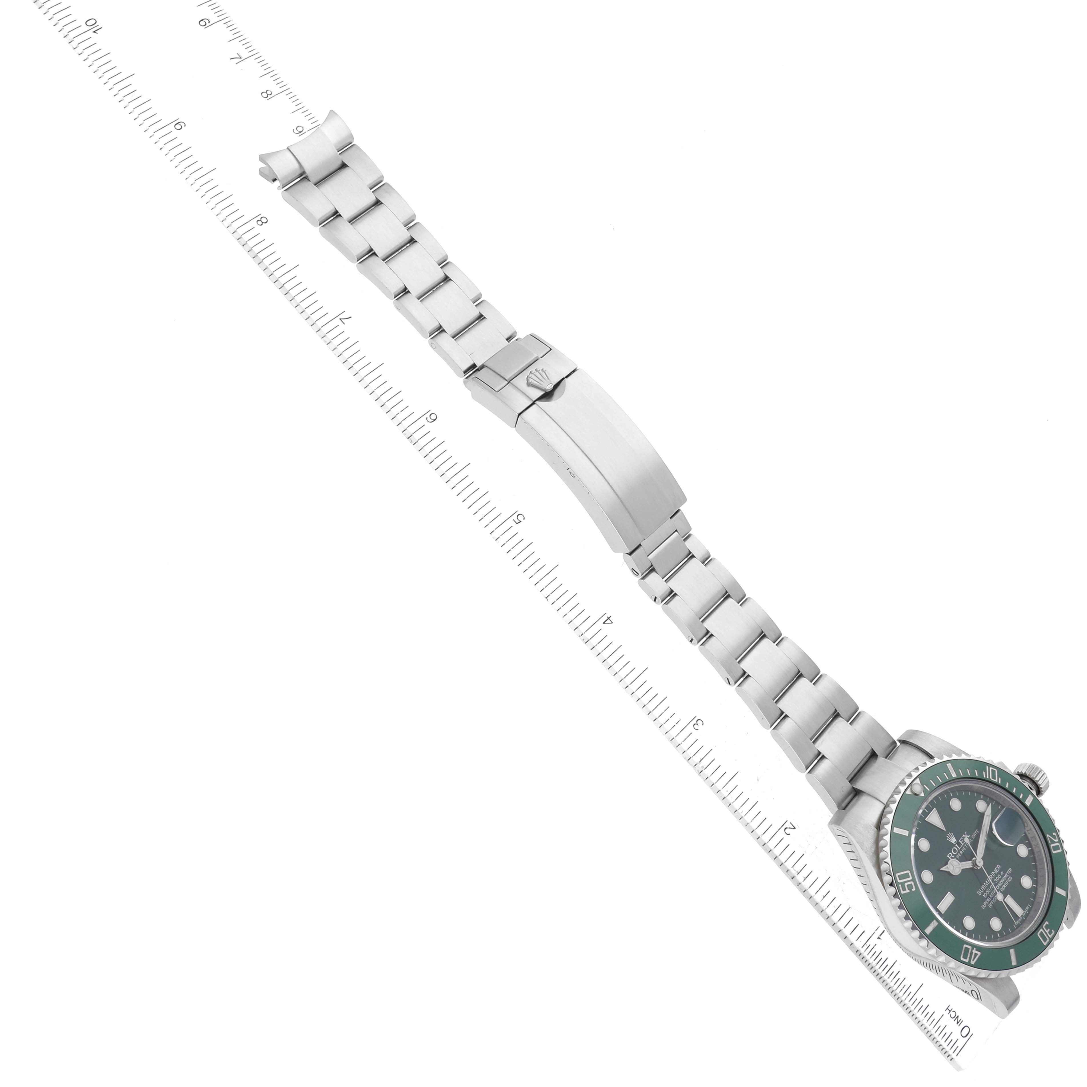 The image shows a Rolex Submariner 116610LV Men's Stainless Steel Green Dial 116610LV Men's Stainless Steel Green Dial watch laid flat, highlighting the bracelet, clasp, and face with a ruler for scale.