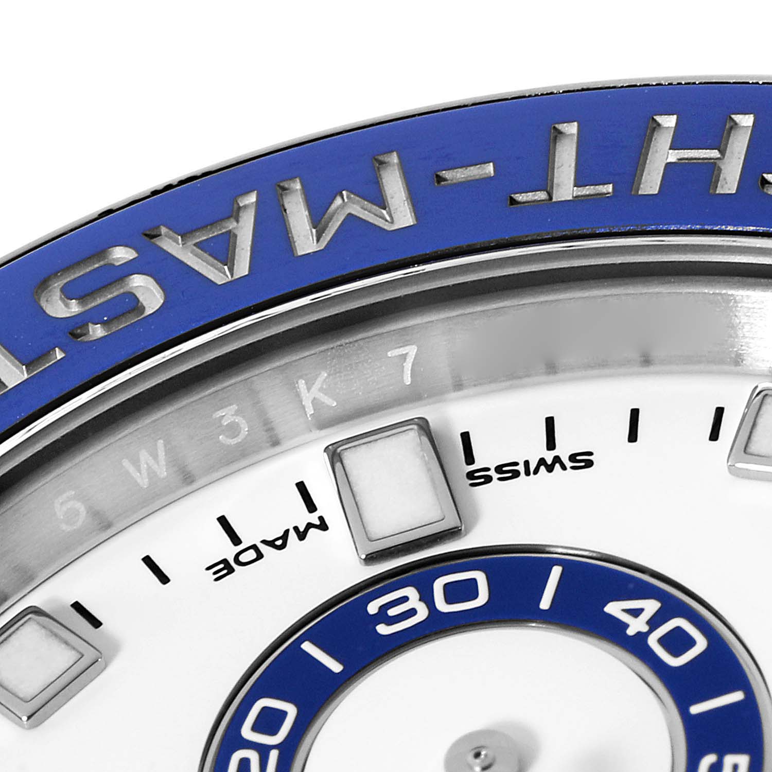This close-up image of a Rolex Yacht-Master 116680 Men's Stainless Steel White Dial 116680 Men's Stainless Steel White Dial watch shows part of the bezel, dial, and "MADE SWISS" marking.