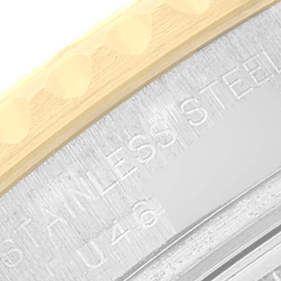 This close-up image of the Rolex Yacht-Master 69623 Women's Steel and Gold (two tone) Grey Dial 69623 Women's Steel and Gold (two tone) Grey Dial watch shows part of the bezel and the engraving on the case in stainless steel.