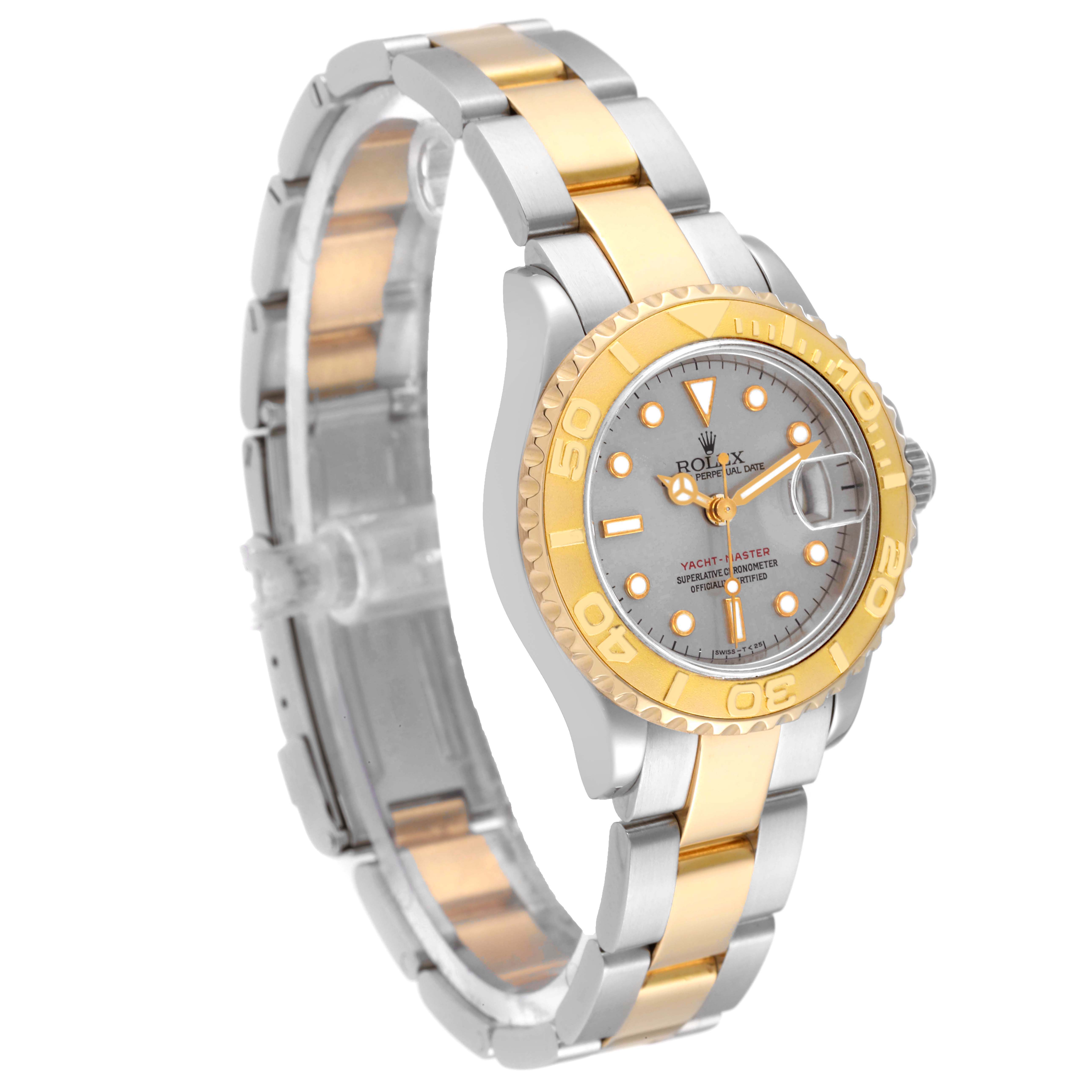 This Rolex Yacht-Master 69623 Women's Steel and Gold (two tone) Grey Dial 69623 Women's Steel and Gold (two tone) Grey Dial watch is shown at a three-quarter angle, displaying its dial, bezel, and two-tone bracelet.
