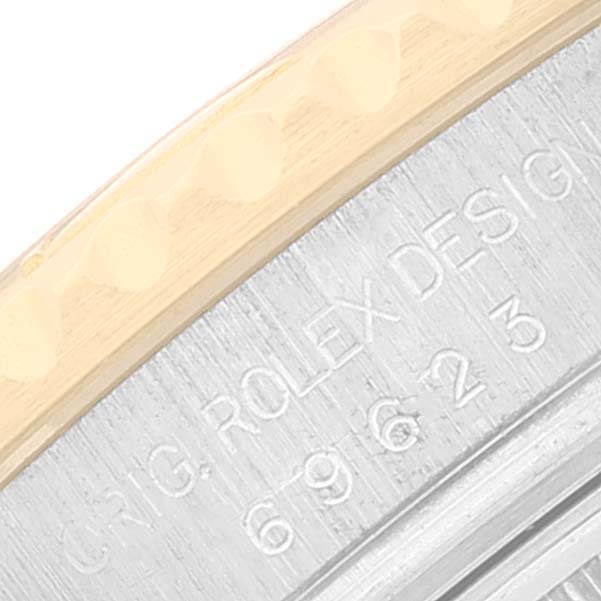 The close-up image shows the engraved side of the bezel of a Rolex Yacht-Master 69623 Women's Steel and Gold (two tone) Grey Dial 69623 Women's Steel and Gold (two tone) Grey Dial watch, highlighting part of the bezel and case.