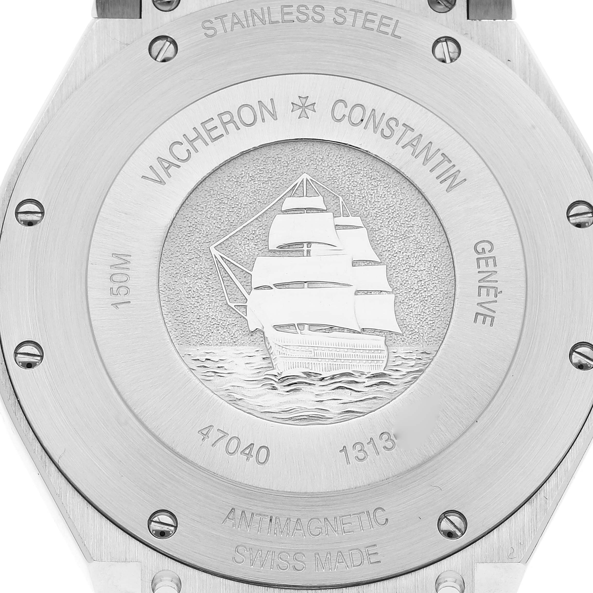 The image shows the case back of a Vacheron Constantin Overseas 47040B01A-9093 Men's Stainless Steel Silver Dial 47040B01A-9093 Men's Stainless Steel Silver Dial watch featuring an engraving of a ship and various inscriptions.