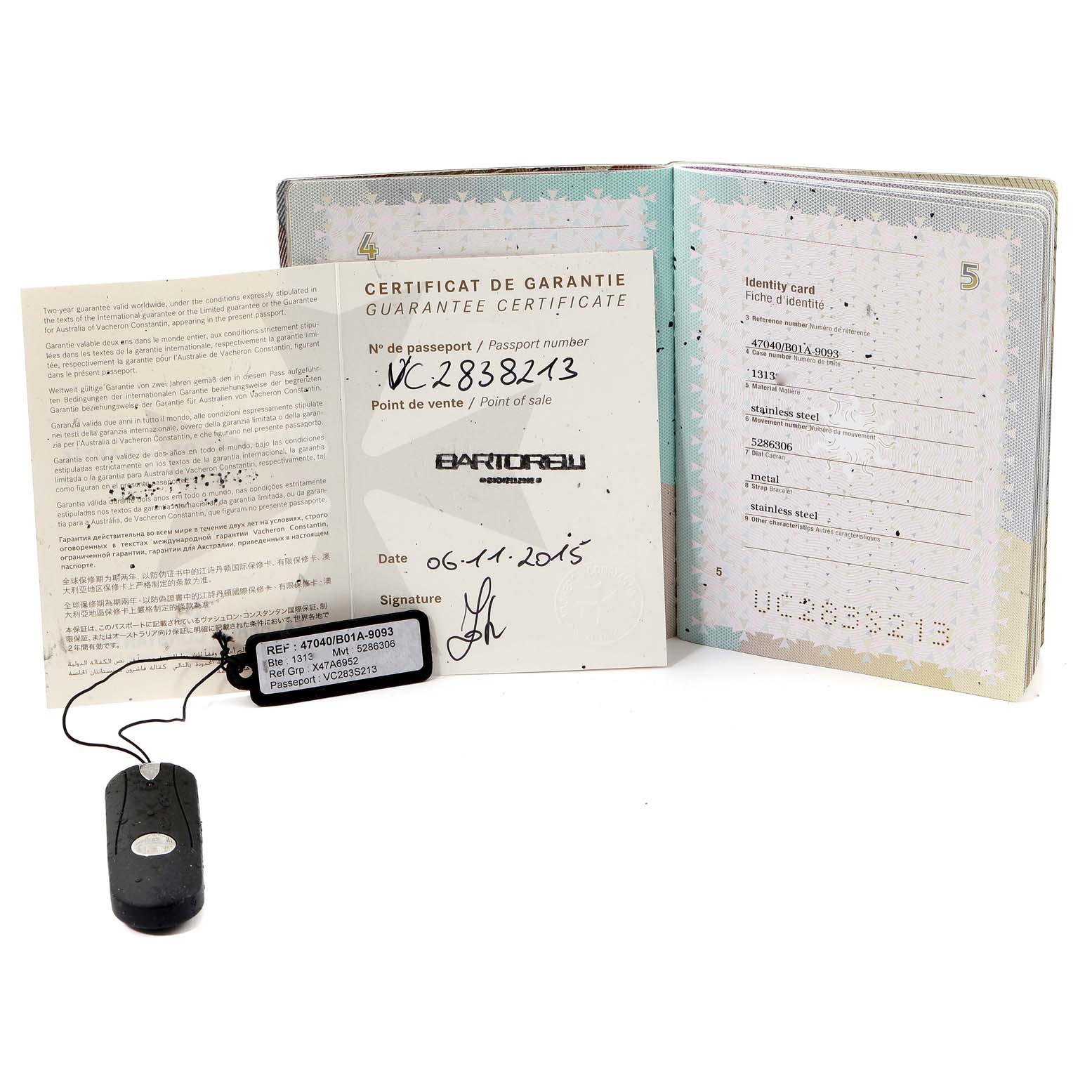 The image shows guarantee certificates and a tag for a Vacheron Constantin Overseas 47040B01A-9093 Men's Stainless Steel Silver Dial 47040B01A-9093 Men's Stainless Steel Silver Dial model watch viewed from the front.