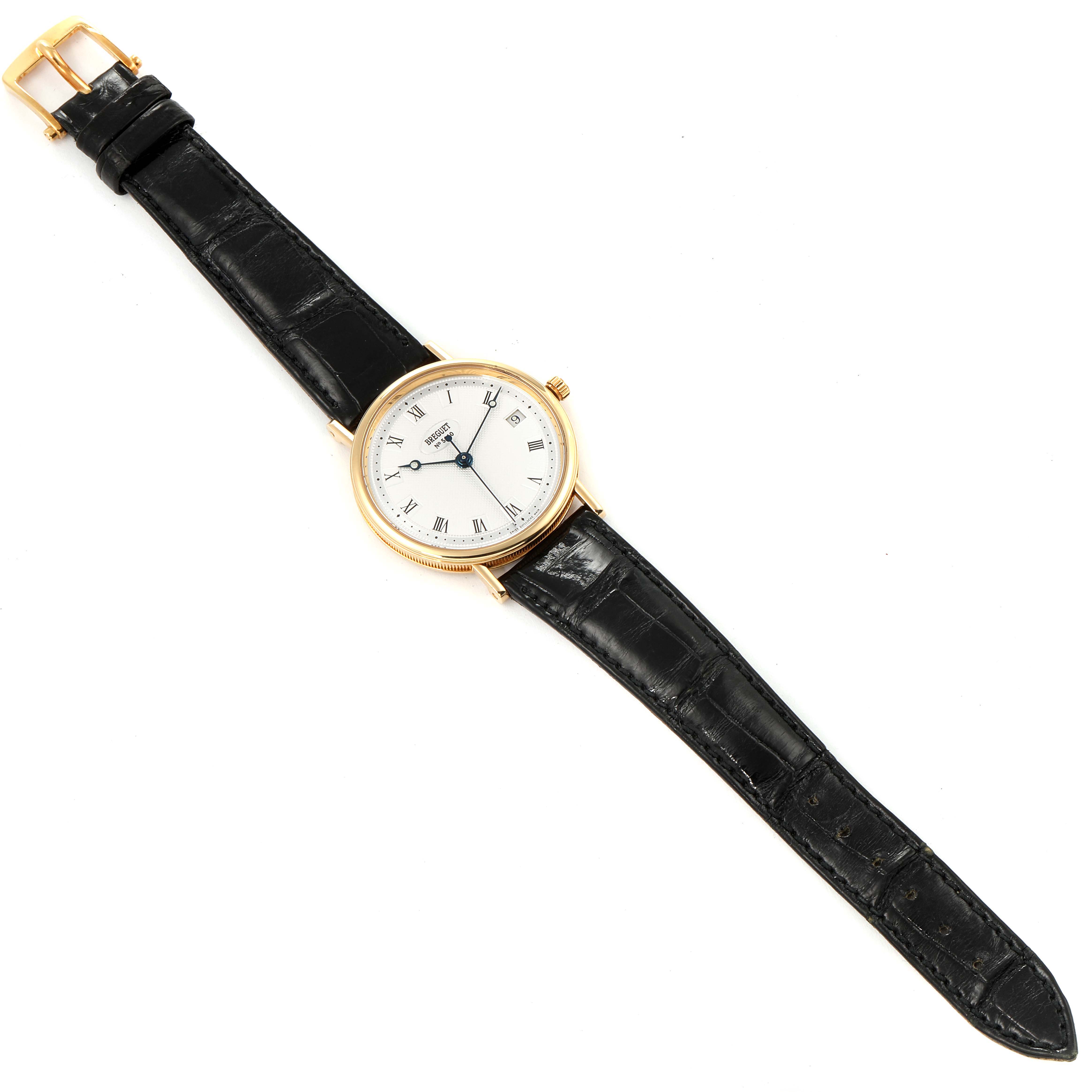 This image shows a Breguet Classique 3910 Men's Yellow Gold Silver Dial 3910 Men's Yellow Gold Silver Dial watch laid flat, displaying the dial, black leather strap, and a gold buckle.