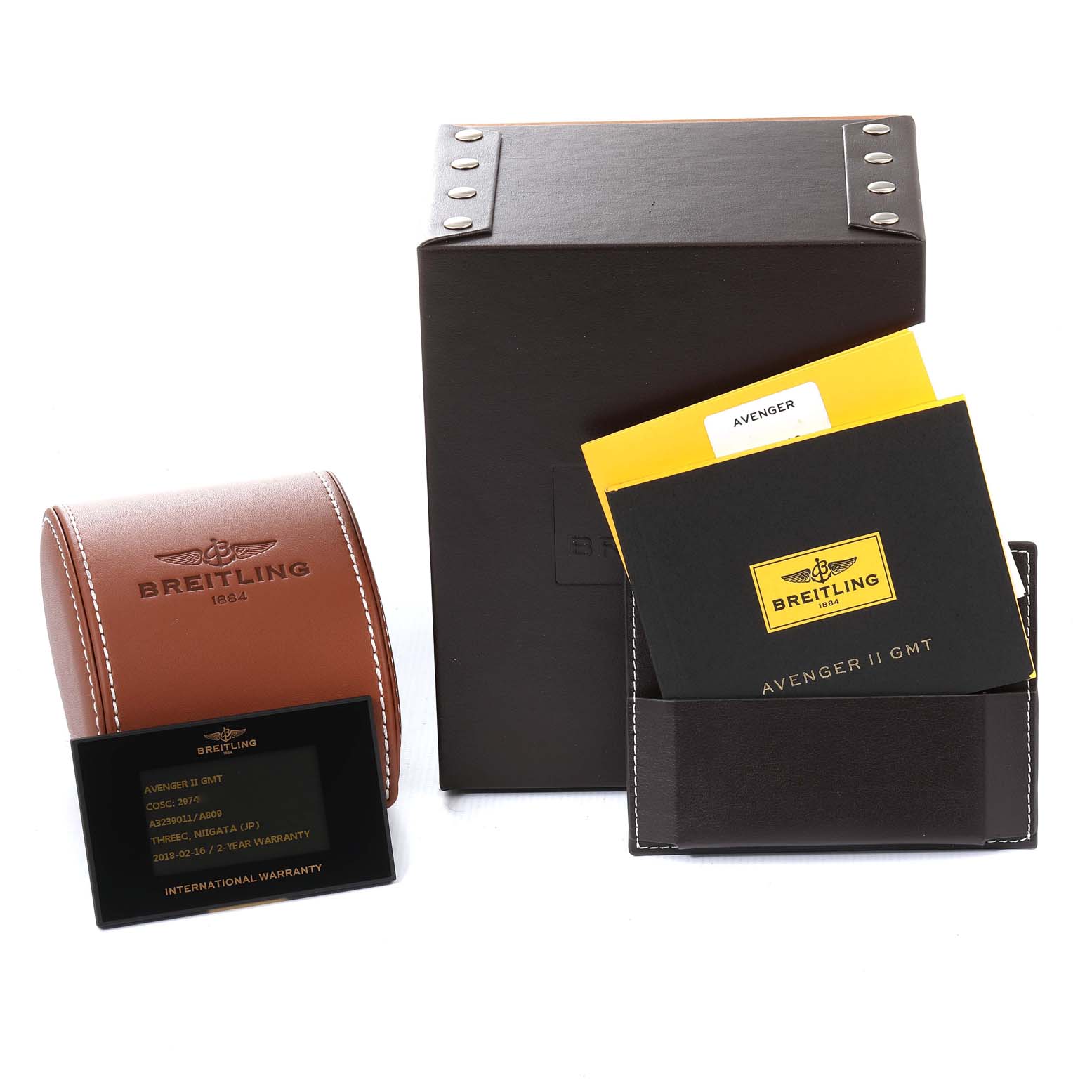 The image shows the accessories of the Breitling Avenger A3239011-C872-170A Men's Stainless Steel Mother of Pearl Dial A3239011-C872-170A Men's Stainless Steel Mother of Pearl Dial model, including a leather case, box, manuals, and warranty card.