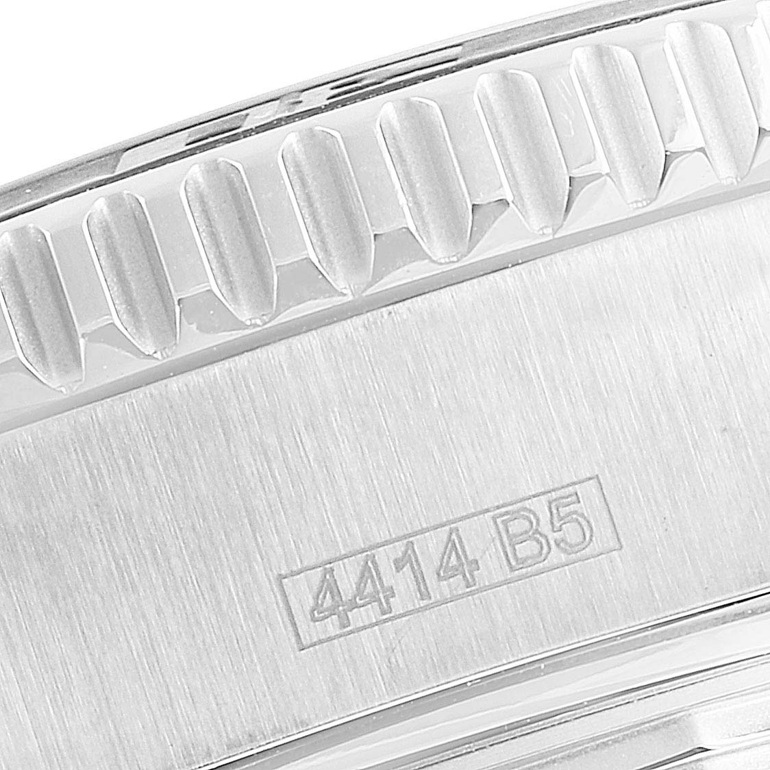 This close-up image of the Breitling Superocean A17391 Men
s Stainless Steel Black Dial A17391 Men
s Stainless Steel Black Dial watch shows the side of the bezel and part of the case with a "4414 B5" engraving.