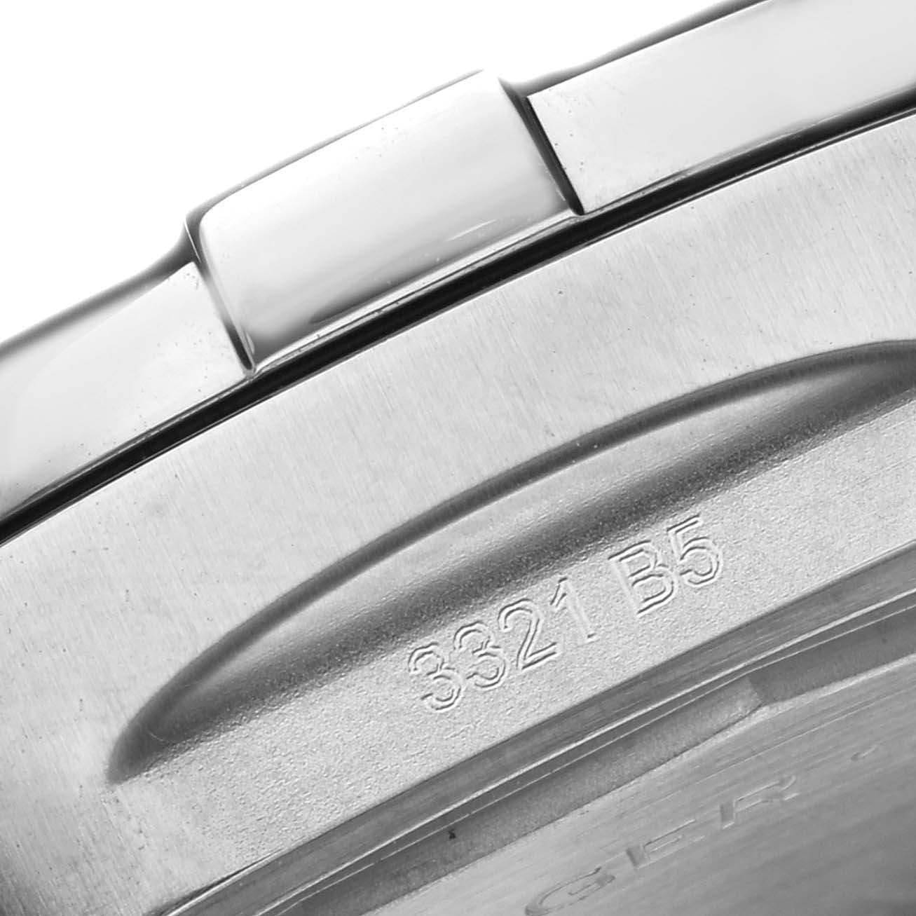The image shows a close-up of the back case of a Breitling Avenger A32397 Men's Stainless Steel White Dial A32397 Men's Stainless Steel White Dial watch featuring part of the serial number.