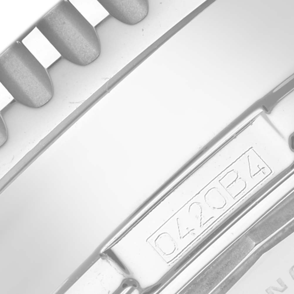 This close-up image shows a portion of the bezel and case back of a Breitling Navitimer A24322 Men
s Stainless Steel Blue Dial A24322 Men
s Stainless Steel Blue Dial watch.