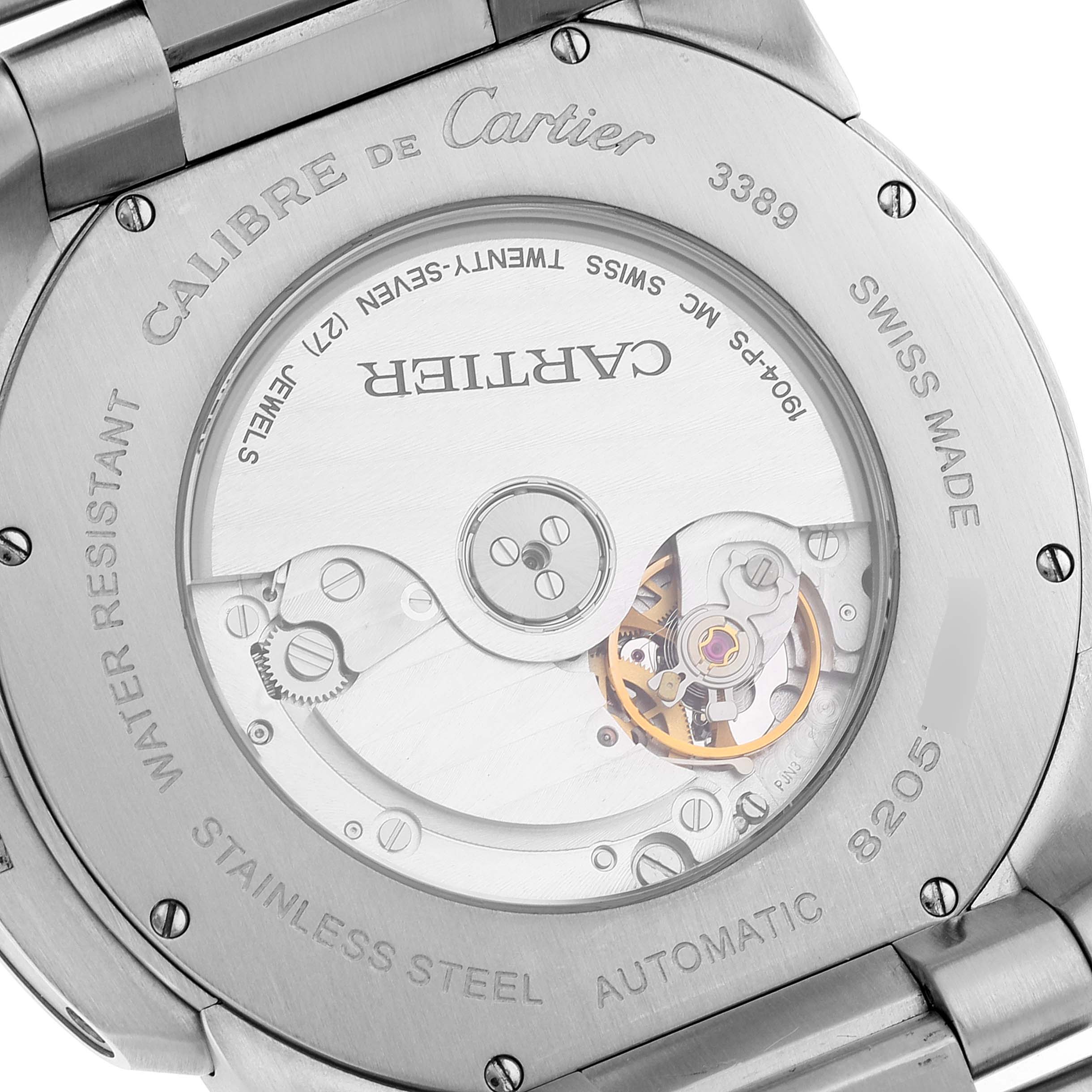 This image shows the back case of the Calibre de Cartier watch, revealing its internal mechanical parts.