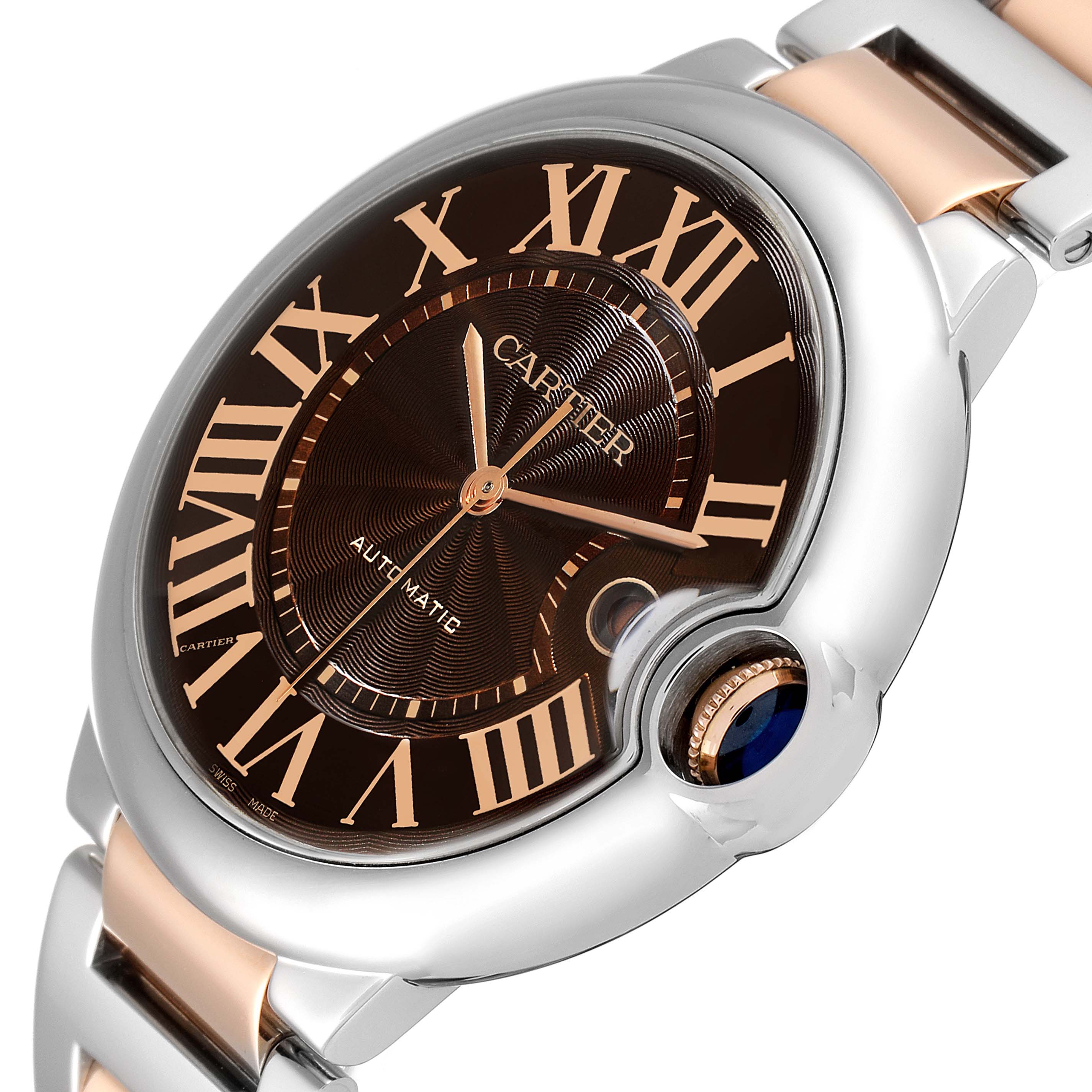 The image shows a close-up view of a Cartier Ballon Bleu W6920032 Men's Steel and Gold (two tone) Brown Dial W6920032 Men's Steel and Gold (two tone) Brown Dial watch, highlighting its dial, crown, and part of its bracelet.