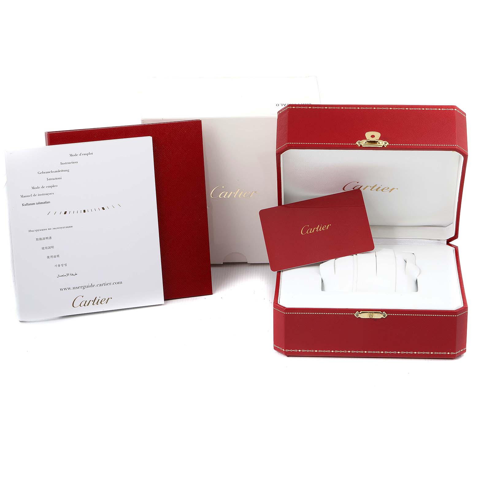 This image shows the packaging and accessories of a Rotonde model by Cartier, including boxes, a card, and manuals.