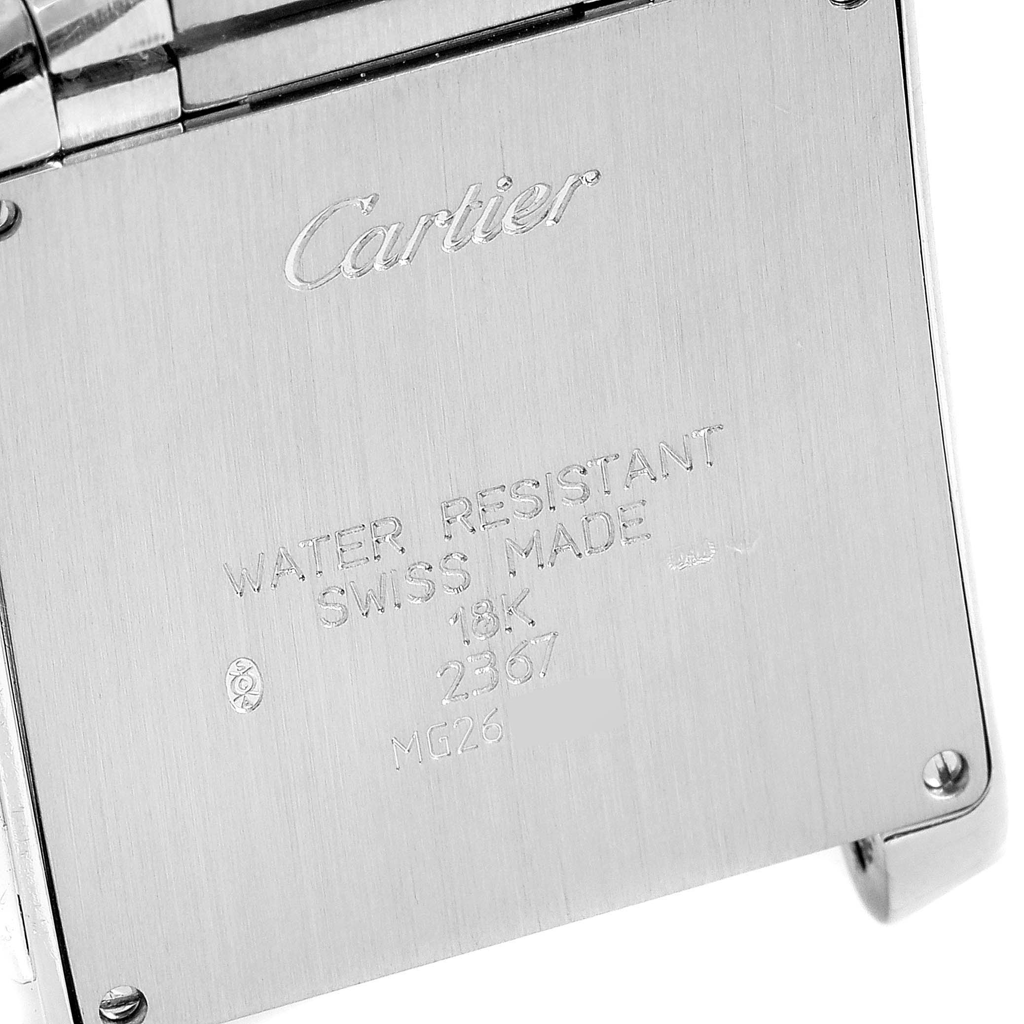 This image shows the back of a Cartier Tank Française watch, featuring brand engravings and specifications.