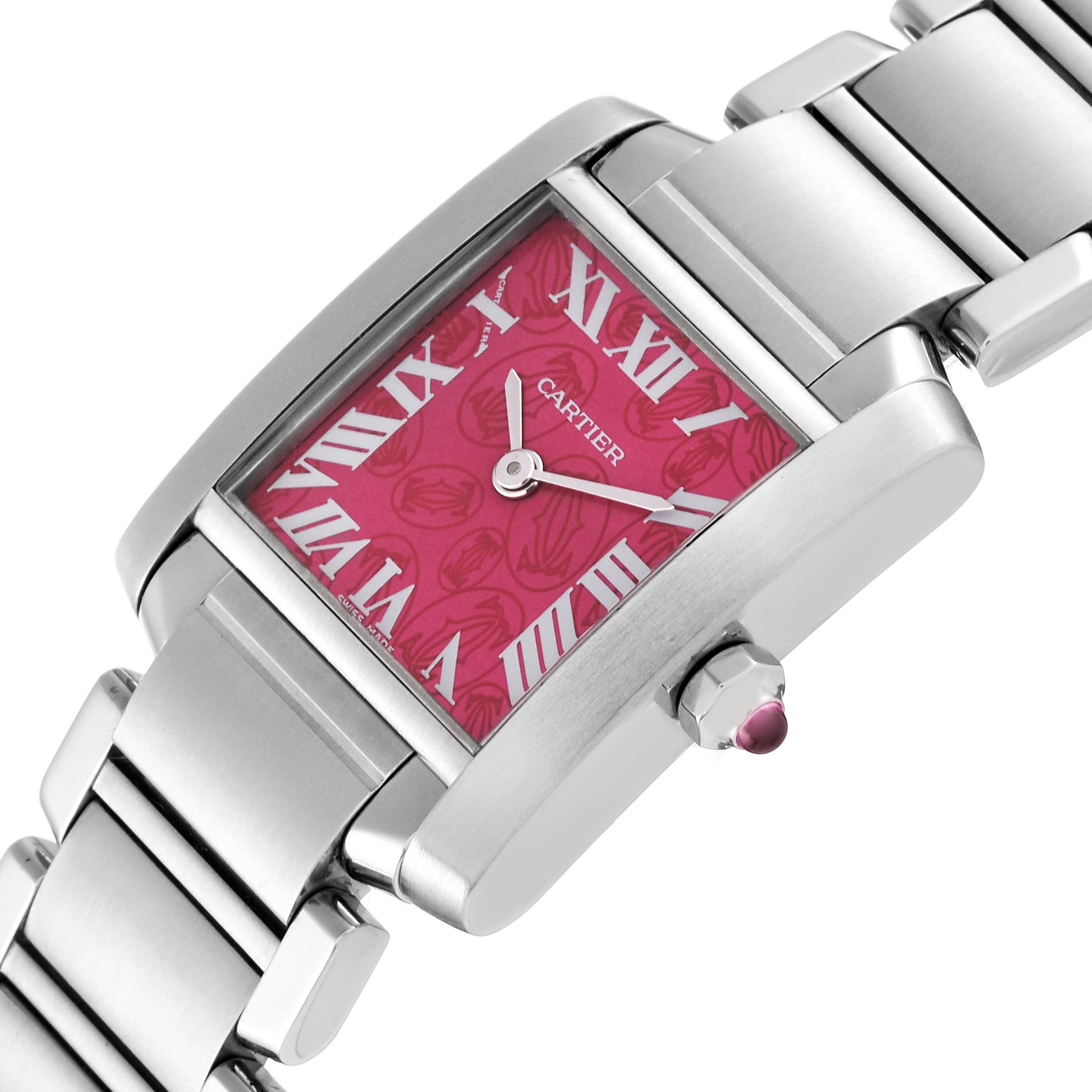This Cartier Tank Française watch is shown from a top-side angle, highlighting its pink dial, Roman numerals, and metal bracelet.