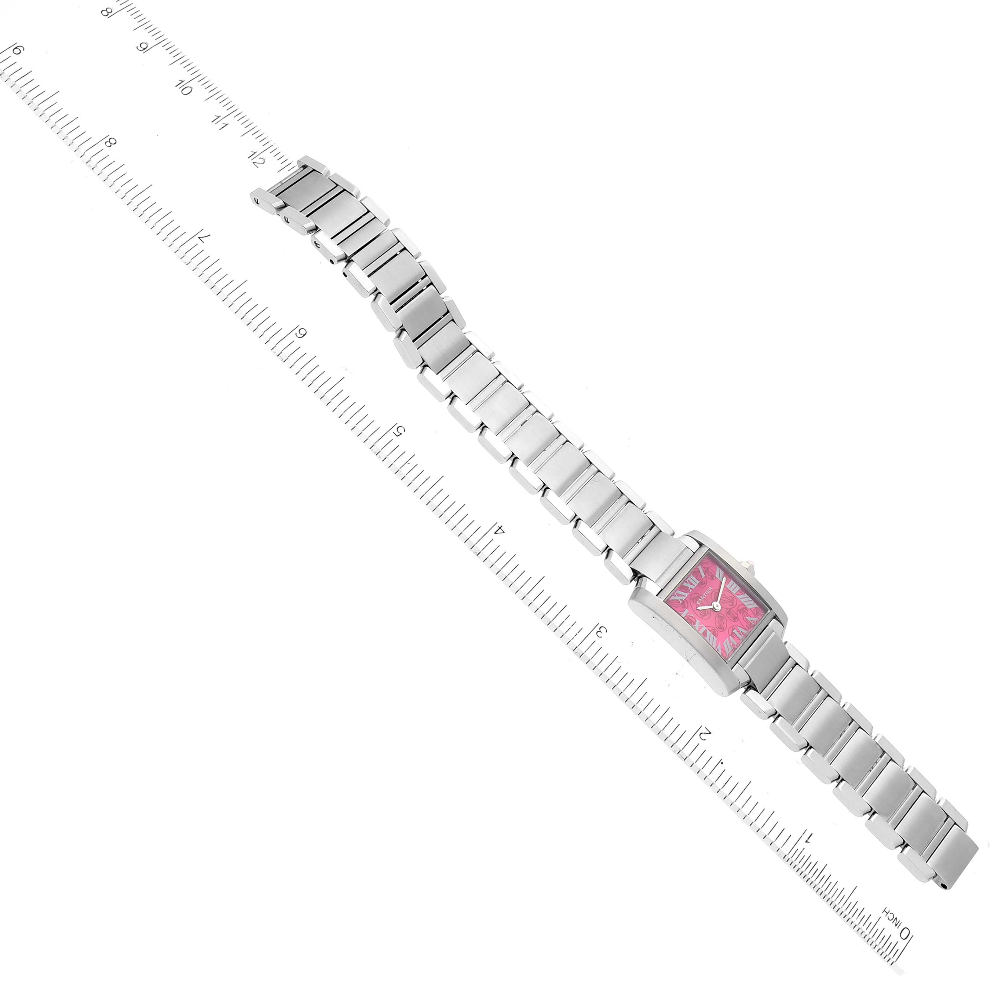 The Cartier Tank Francaise W51030Q3 Women's Stainless Steel Pink Dial W51030Q3 Women's Stainless Steel Pink Dial watch is shown in a top-down angle with a ruler for scale.