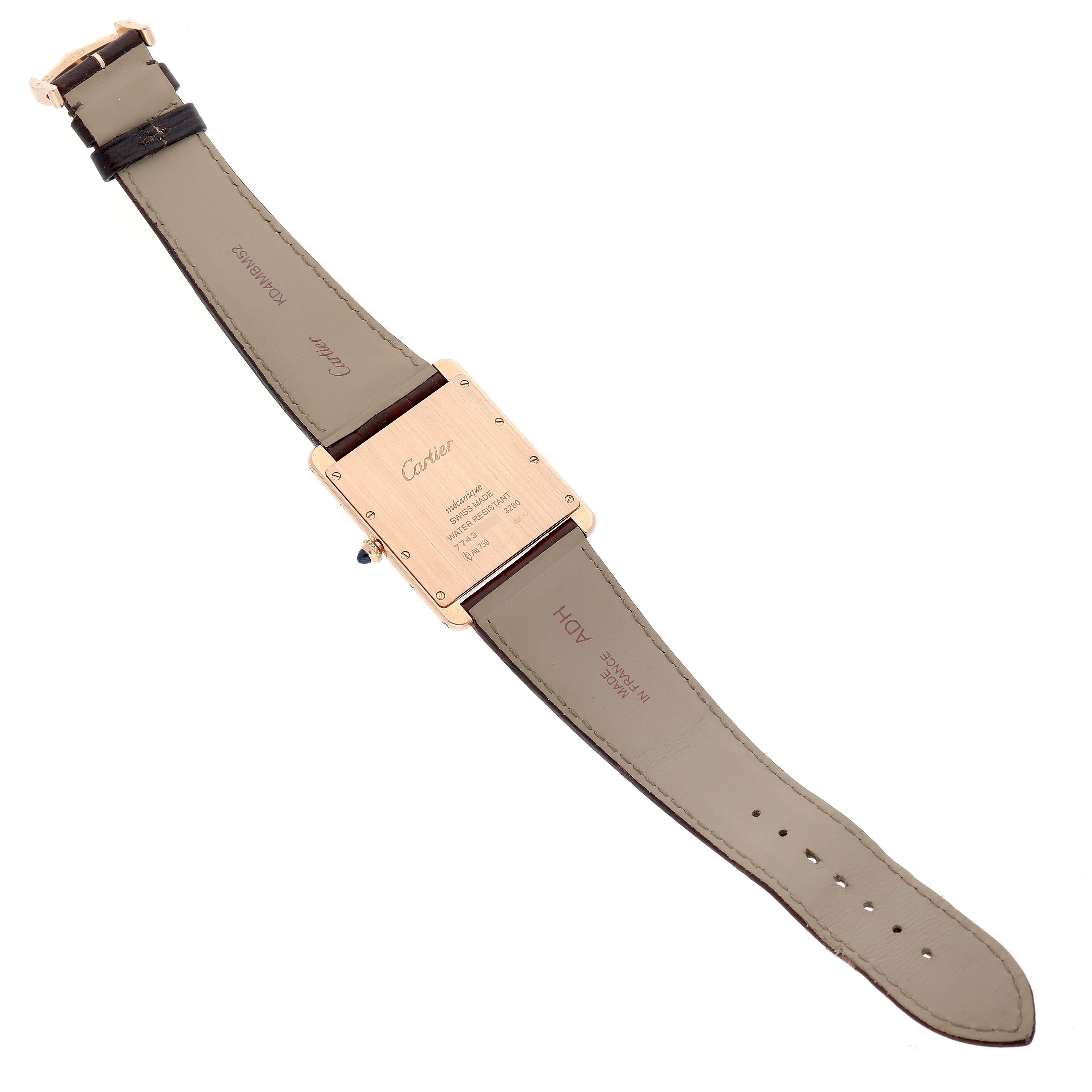 The image shows the back of a Cartier Tank Louis W1560017 Men's Rose Gold Silver Dial watch with visible straps and case-back details.