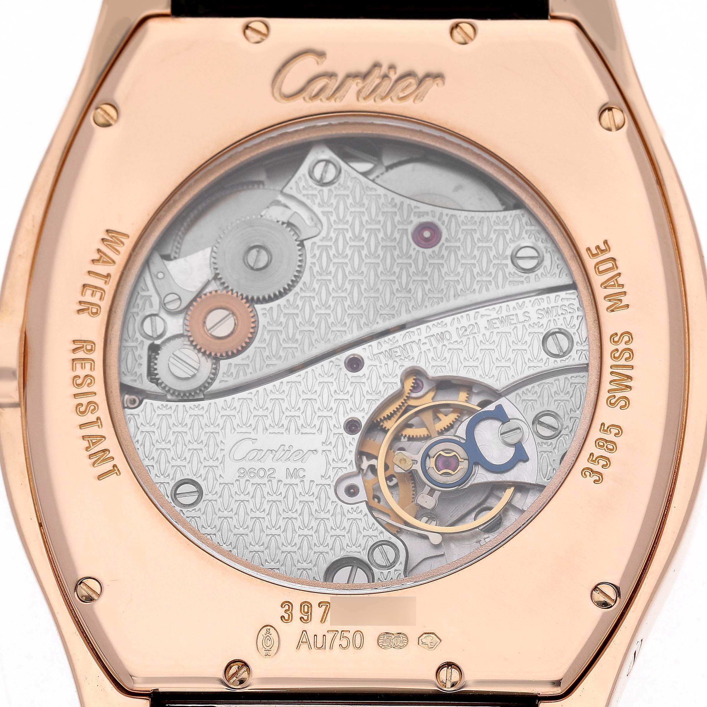 The image shows the back of a Cartier Tortue W1556324 Men's Rose Gold Silver Dial watch, highlighting its intricate mechanical movement and engraving details.