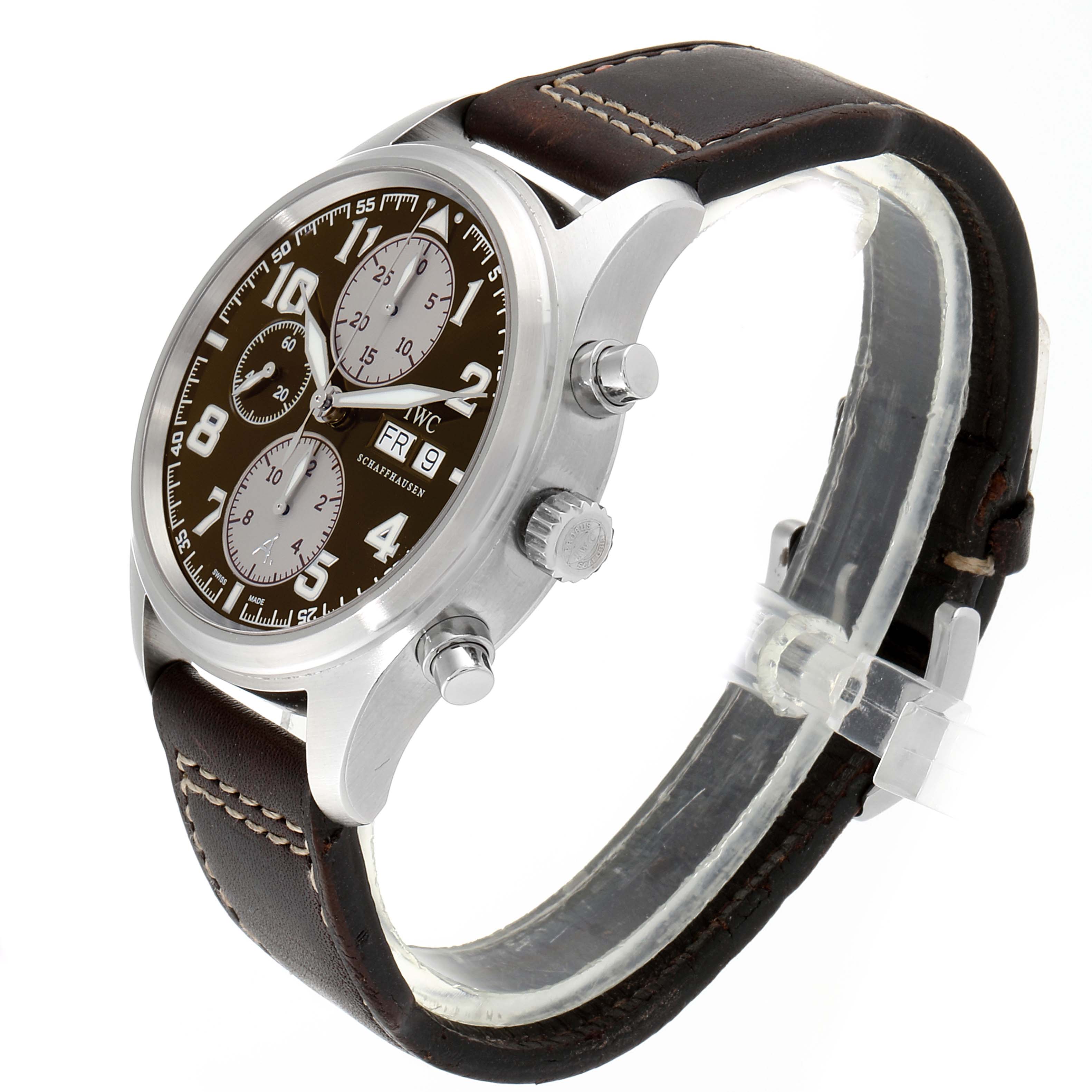 This image shows an angled side view of an IWC Pilot IW371709 Men's Stainless Steel Brown Dial IW371709 Men's Stainless Steel Brown Dial model watch, displaying its dial, crown, pushers, and leather strap.