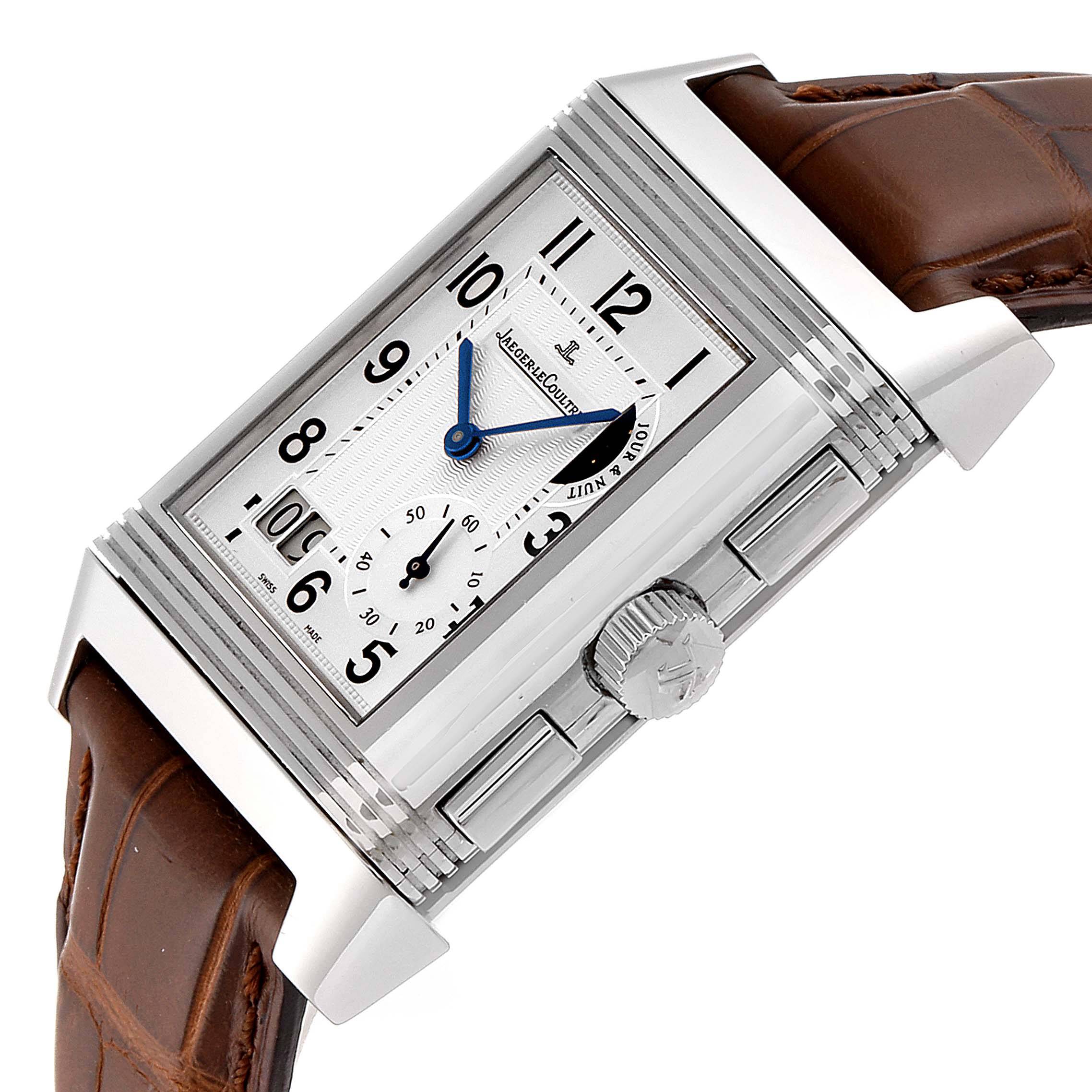 The Jaeger-LeCoultre Reverso watch is shown at an angle highlighting its dial, crown, case, and brown leather strap.
