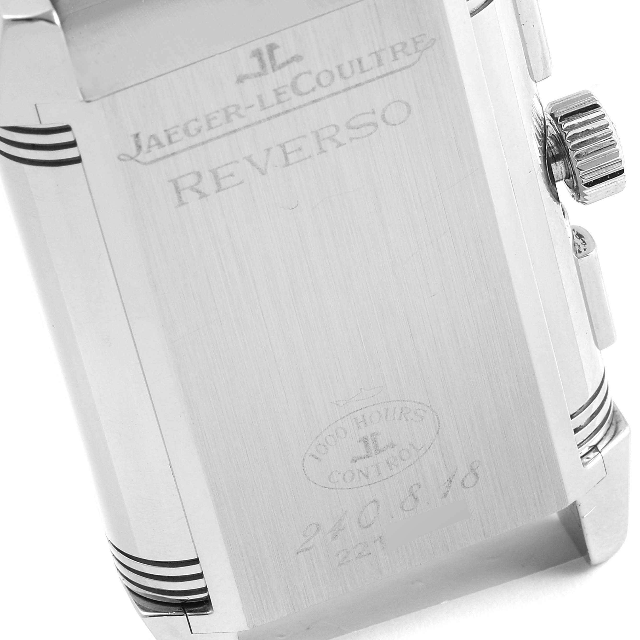 The image shows the back case and crown of a Jaeger-LeCoultre Reverso watch at an angle.