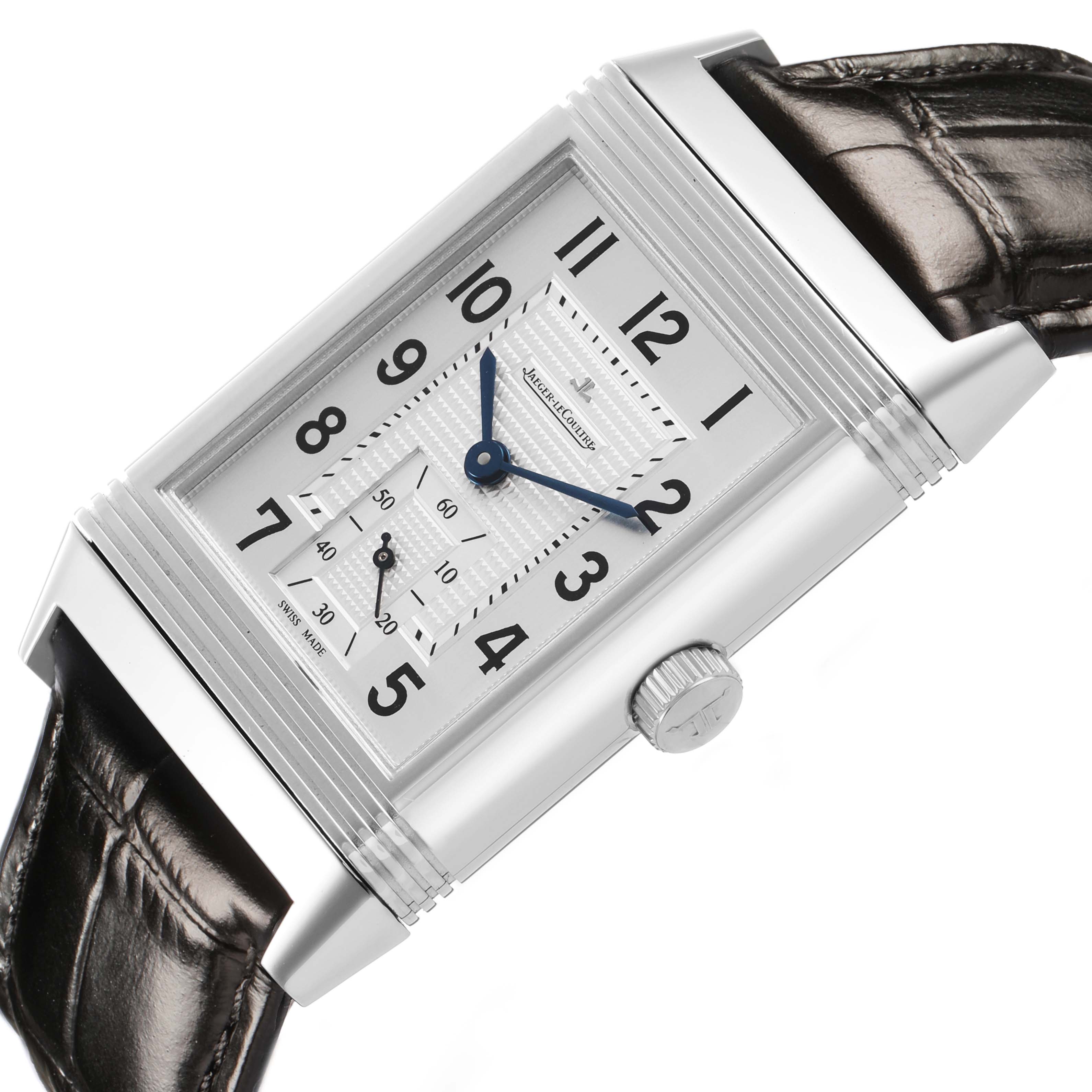The Jaeger-LeCoultre Reverso watch is shown at a slight angle, highlighting its rectangular face, crown, and leather strap.
