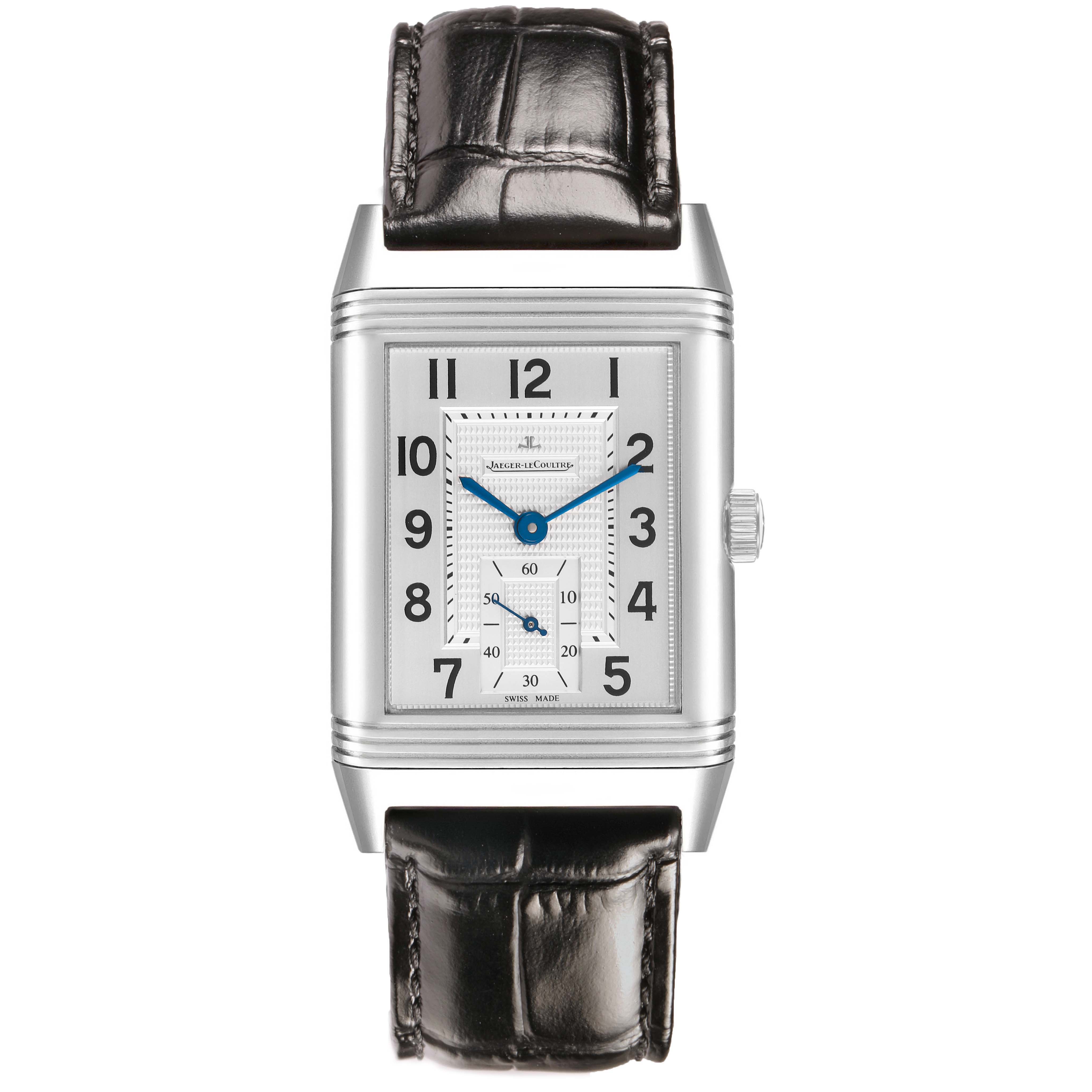 The Jaeger-LeCoultre Reverso watch is shown from the front, displaying its rectangular dial, crown, and leather strap.