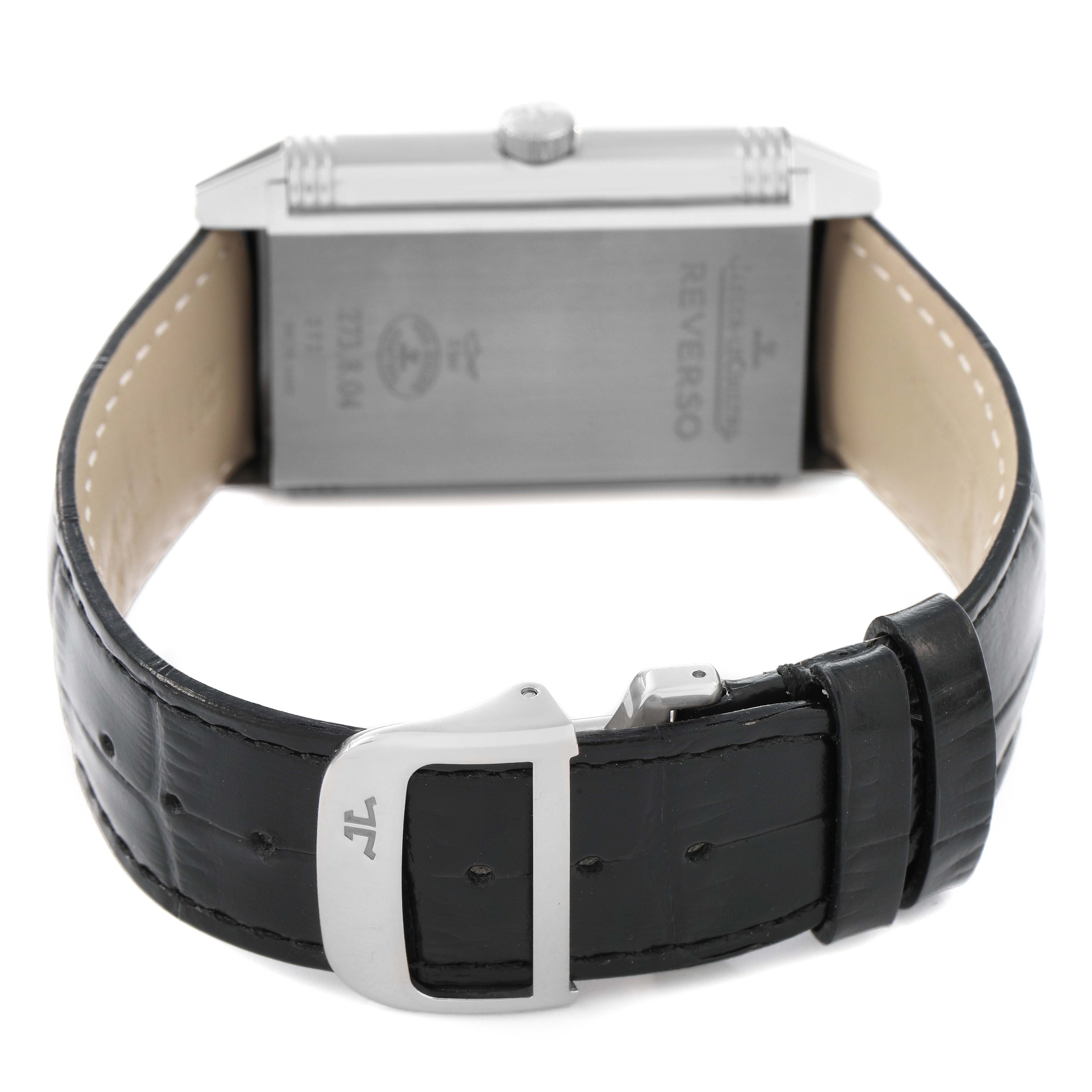 The image shows the Jaeger LeCoultre Reverso Q3738420 / 273.8.04 Men's Stainless Steel Silver Dial watch from a rear angle, highlighting the case back, clasp, and black leather strap.