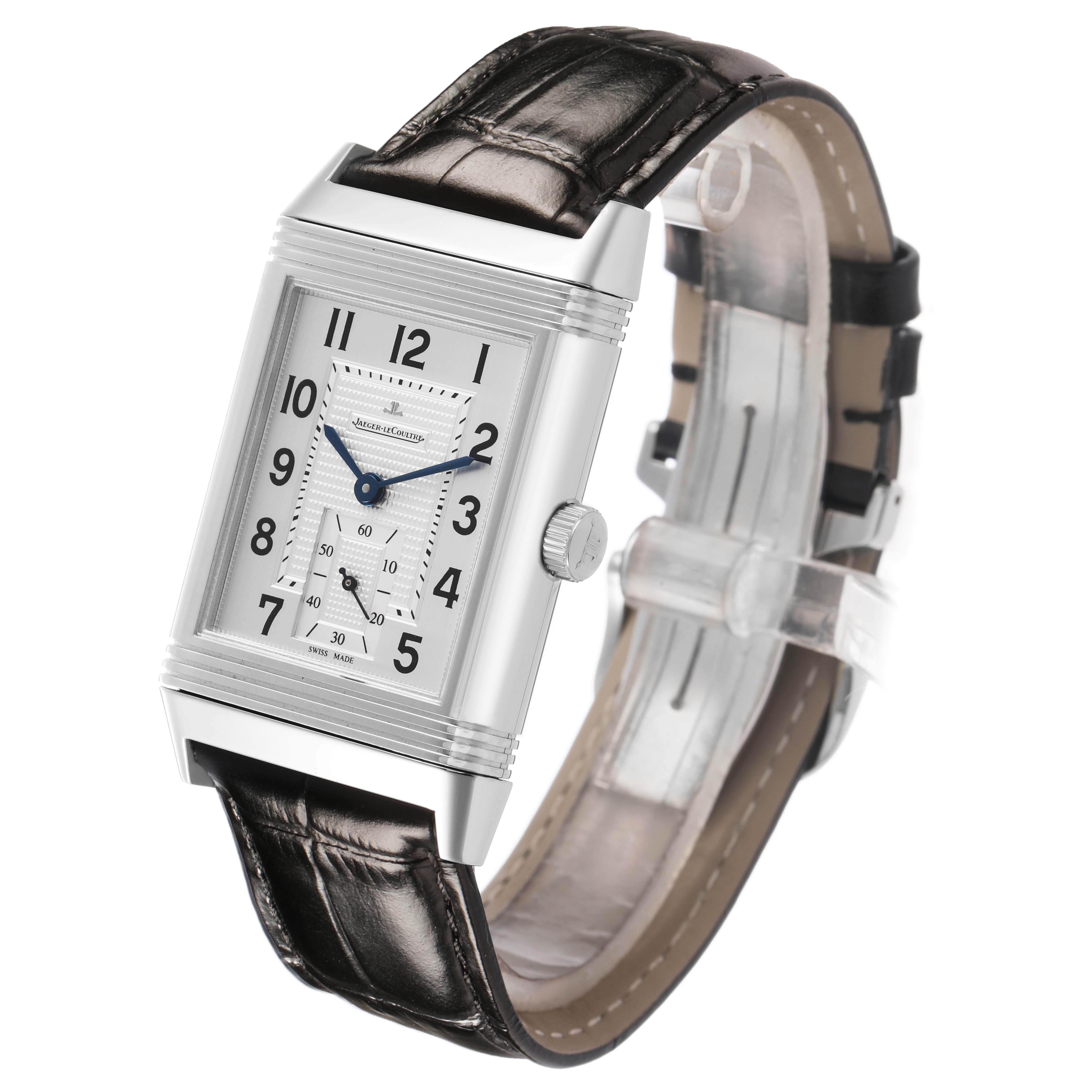 The Jaeger-LeCoultre Reverso watch is shown at a three-quarter angle, highlighting its rectangular face, strap, and crown.